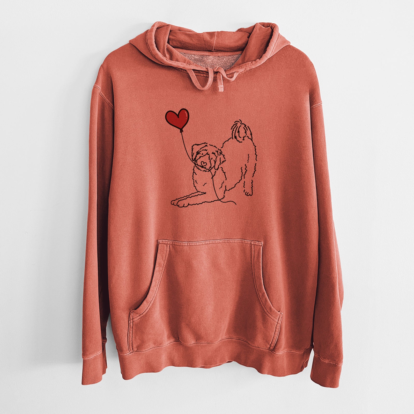 Minimalist line drawing of an Aussiedoodle Heart String holding a heart balloon on an Amber Unisex pigment dyed hoodie