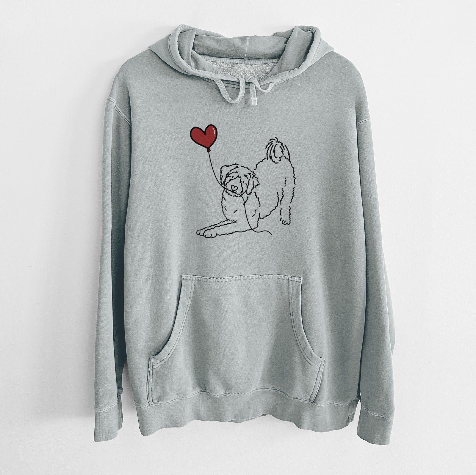 Minimalist line drawing of an Aussiedoodle Heart String holding a heart balloon on a Sage Unisex pigment dyed hoodie