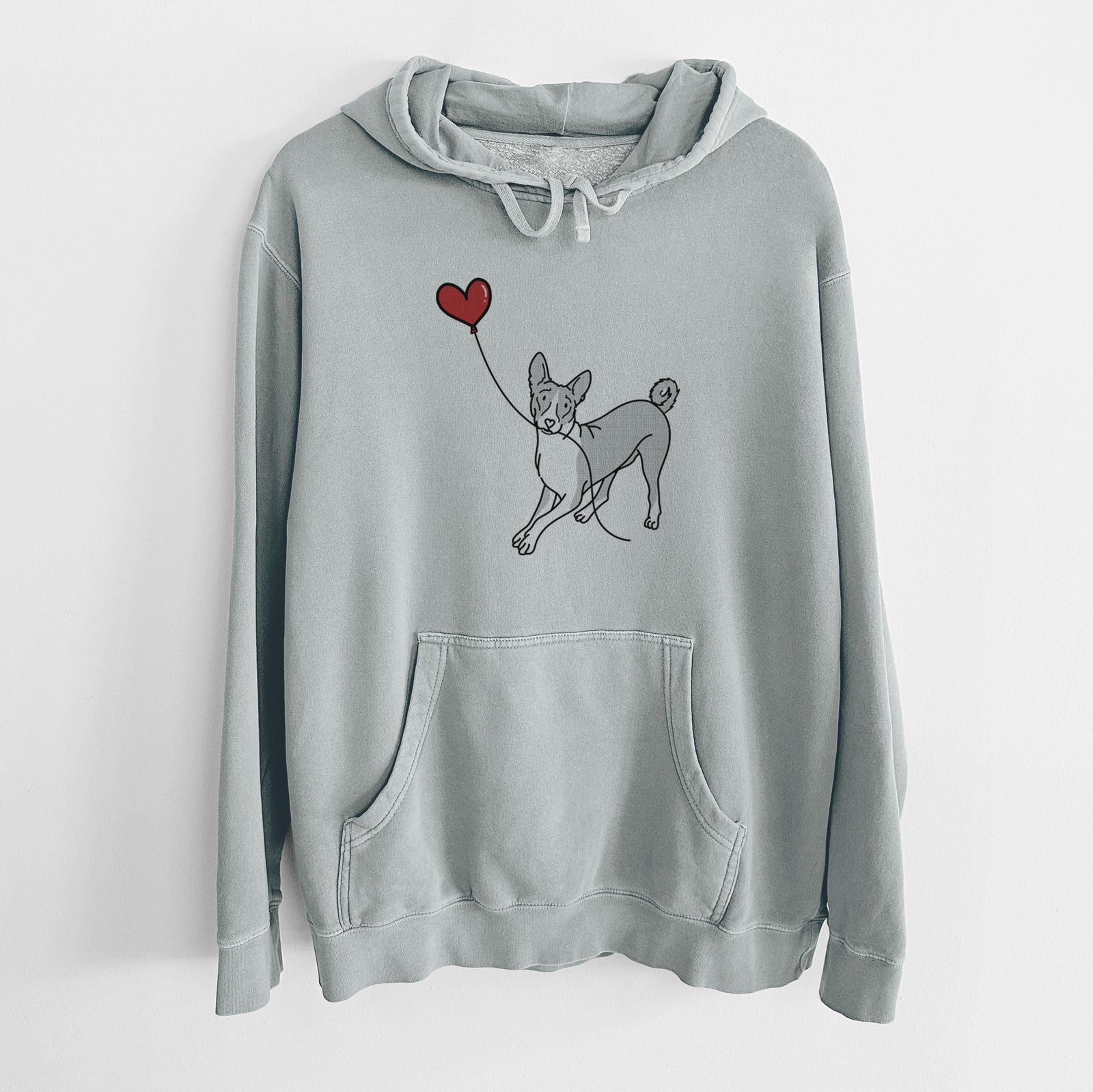Minimalist line drawing of a Basenji Heart String holding a heart balloon on a Sage Unisex pigment dyed hoodie