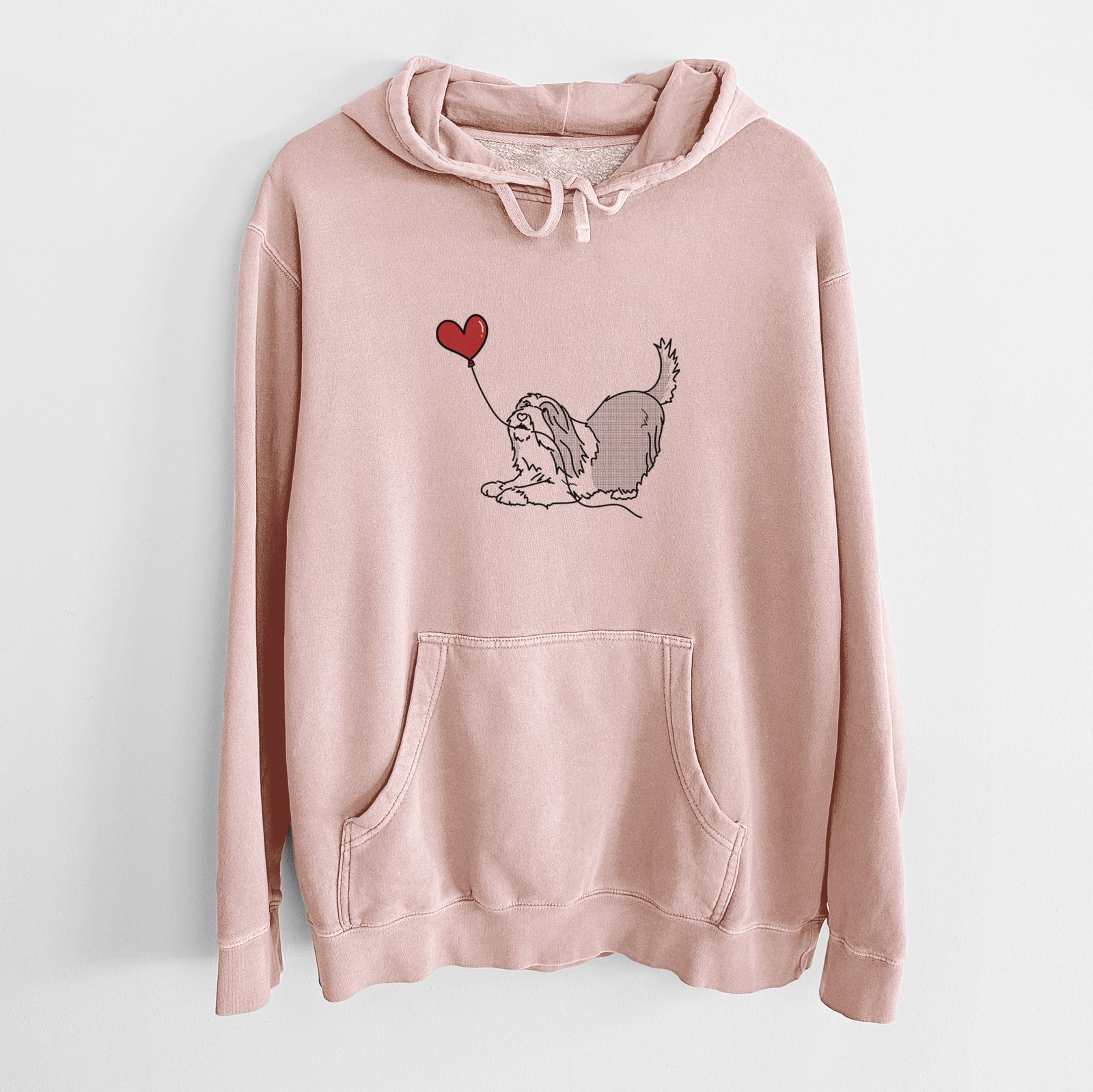 Minimalist line drawing of a Bearded Collie Heart String holding a heart balloon on a Dusty Pink Unisex pigment dyed hoodie