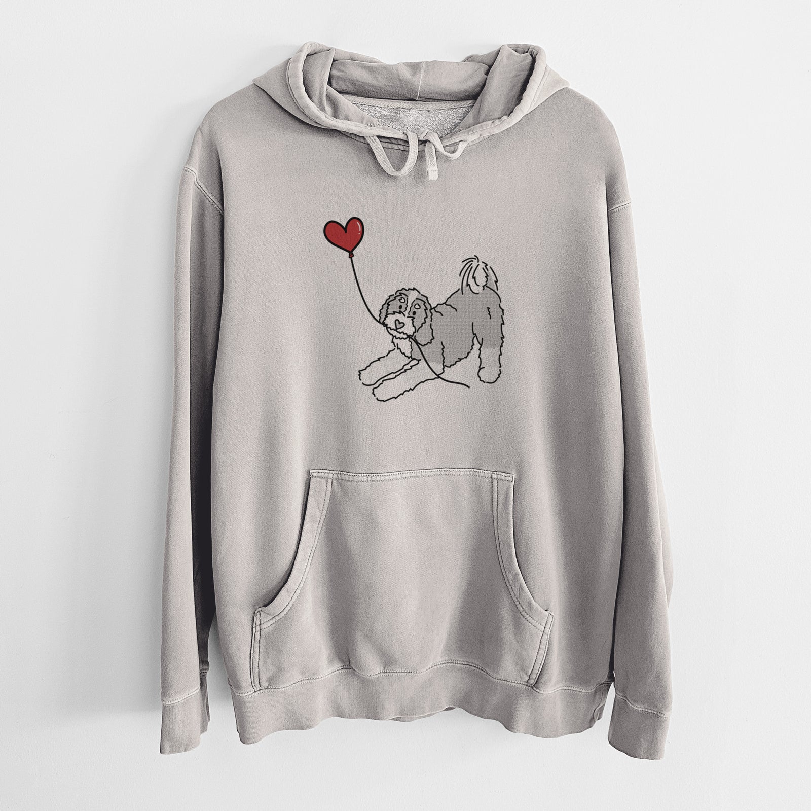 Minimalist line drawing of a Bernedoodle Heart String holding a heart balloon on a Cement Unisex pigment dyed hoodie