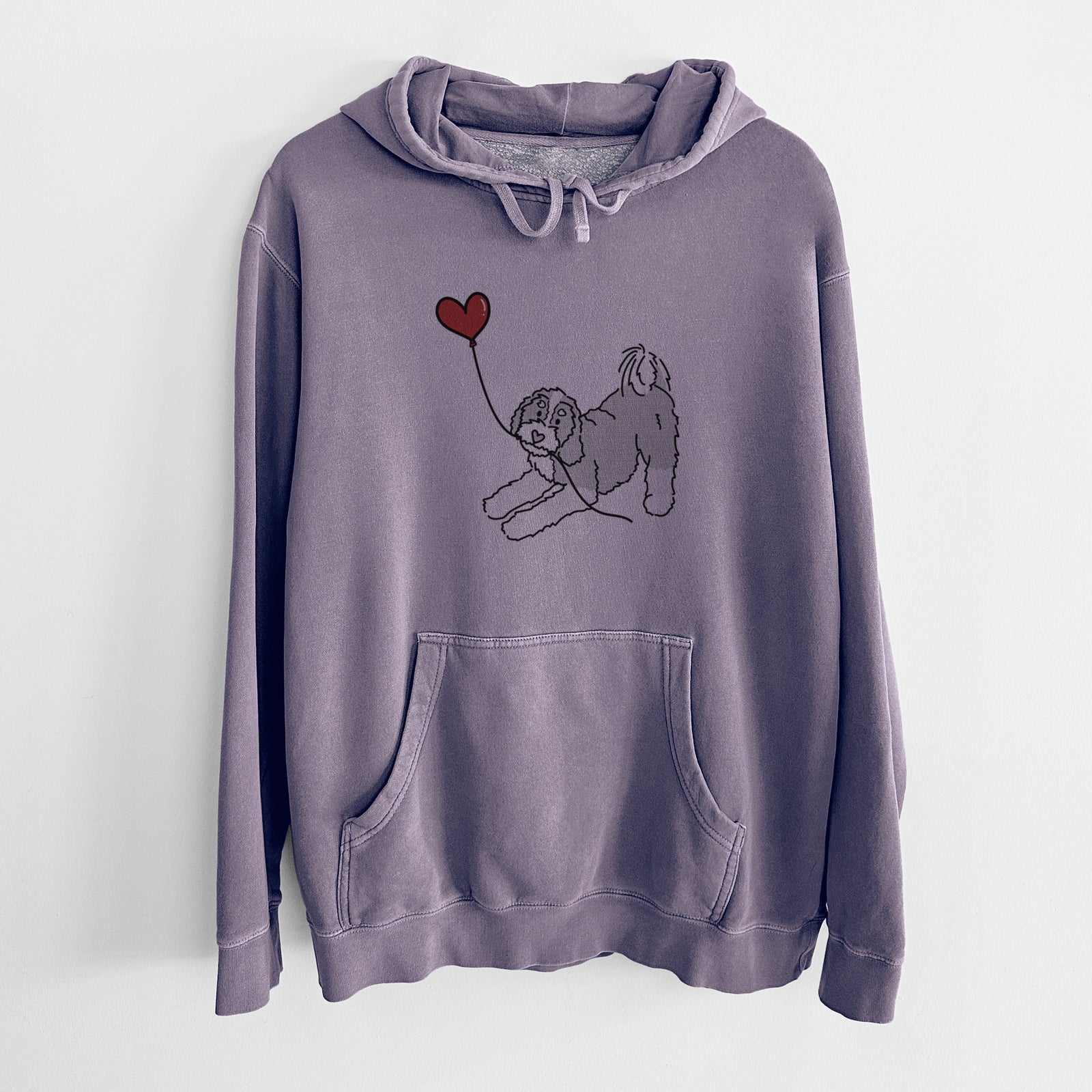 Minimalist line drawing of a Bernedoodle Heart String holding a heart balloon on a Plum Unisex pigment dyed hoodie