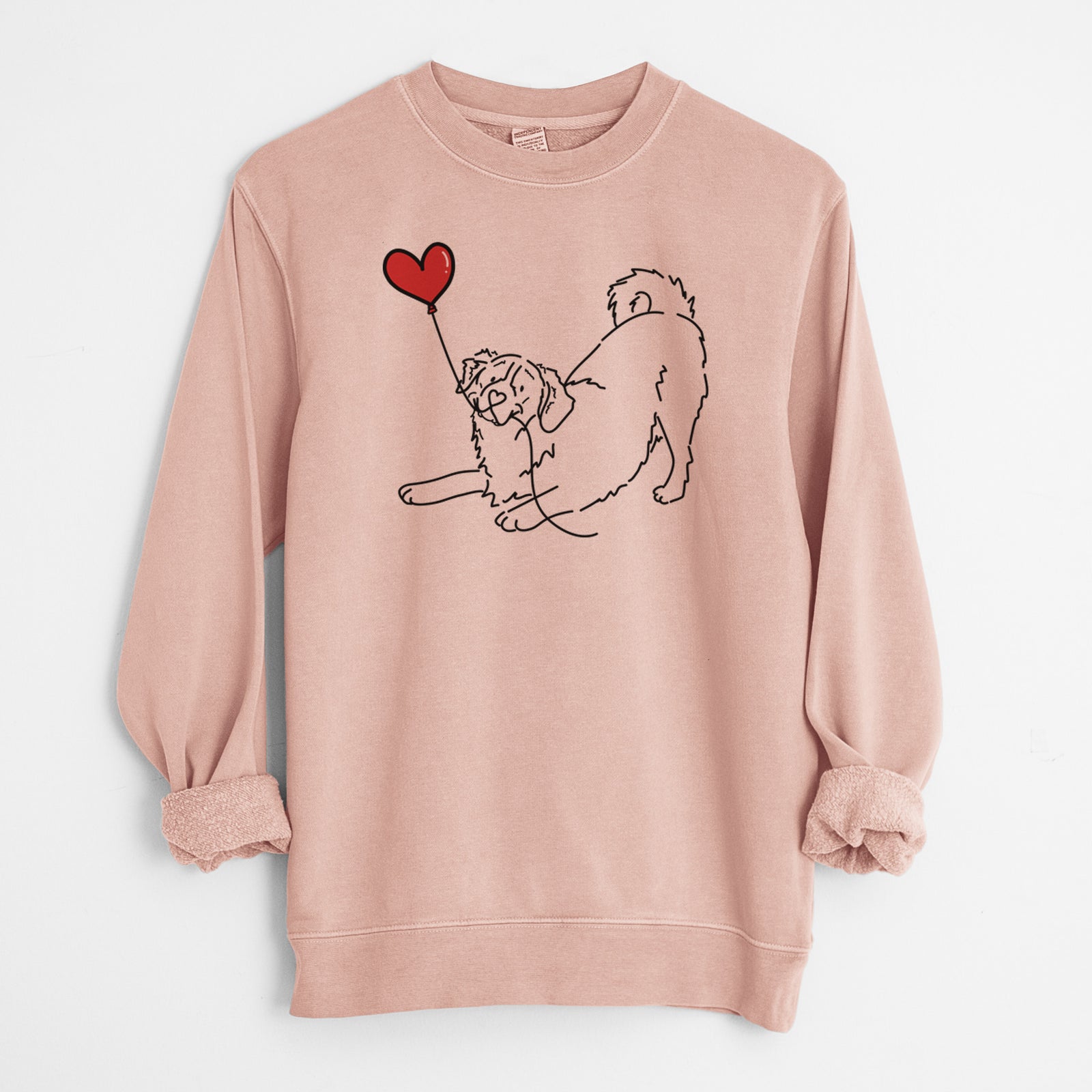 Minimalist line drawing of a Bernese Mountain Dog Heart String holding a heart balloon on a Dusty Pink Unisex pigment dyed crew sweatshirt