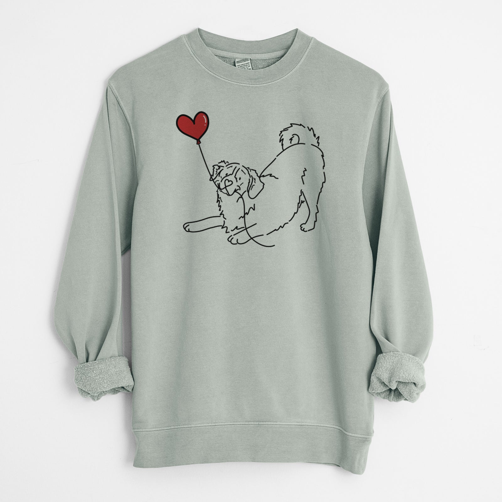 Minimalist line drawing of a Bernese Mountain Dog Heart String holding a heart balloon on a Sage Unisex pigment dyed crew sweatshirt