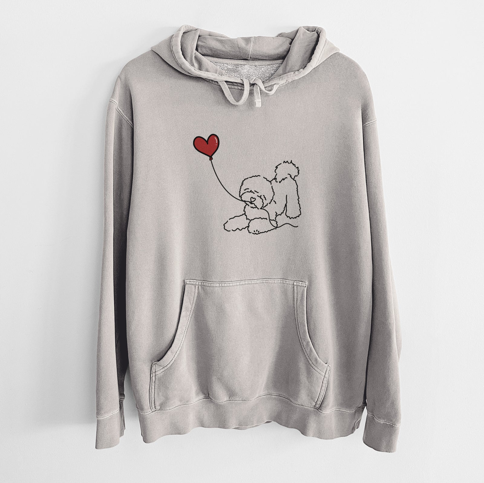 Minimalist line drawing of a Bichon Frise Heart String holding a heart balloon on a Cement Unisex pigment dyed hoodie