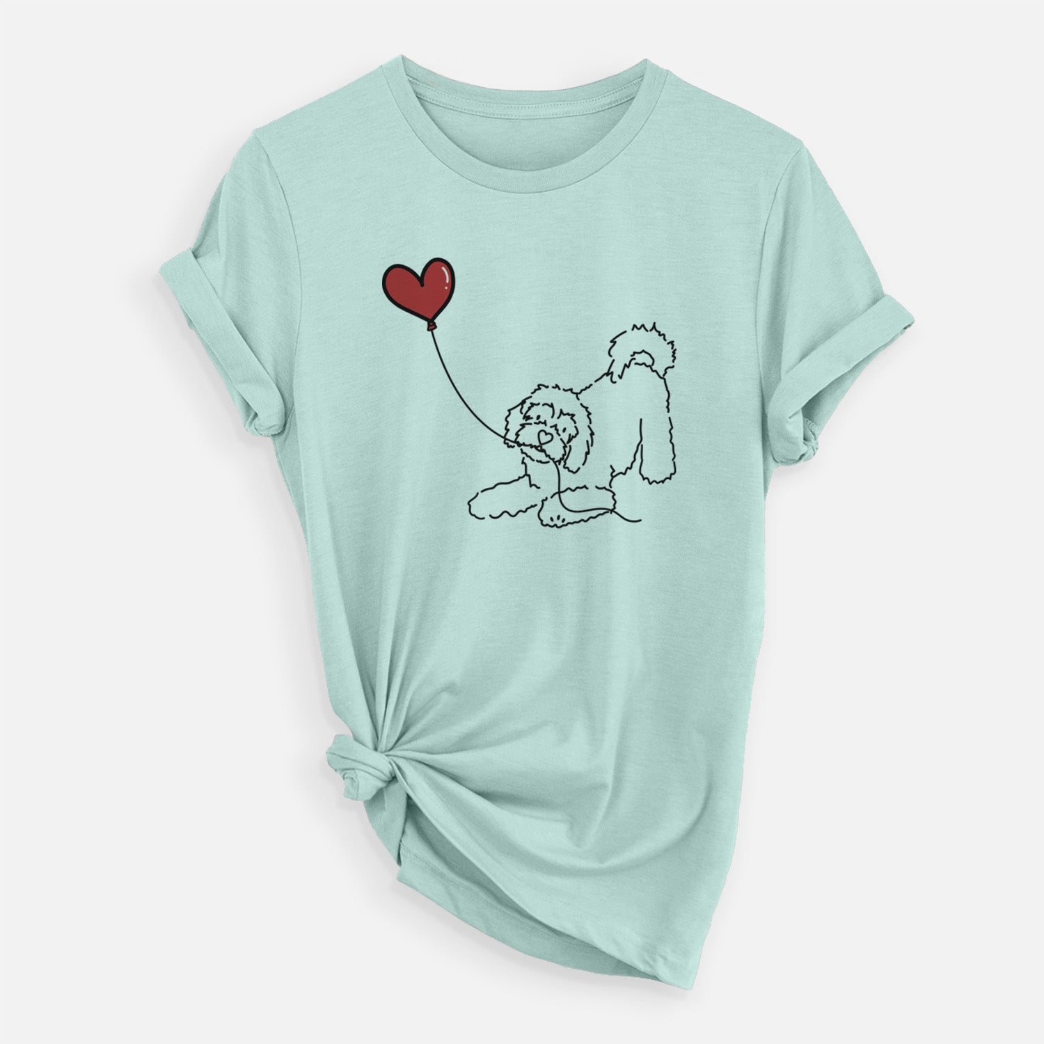 Minimalist line drawing of a Cavachon Heart String holding a heart balloon on a Heather Sage Unisex crewneck
