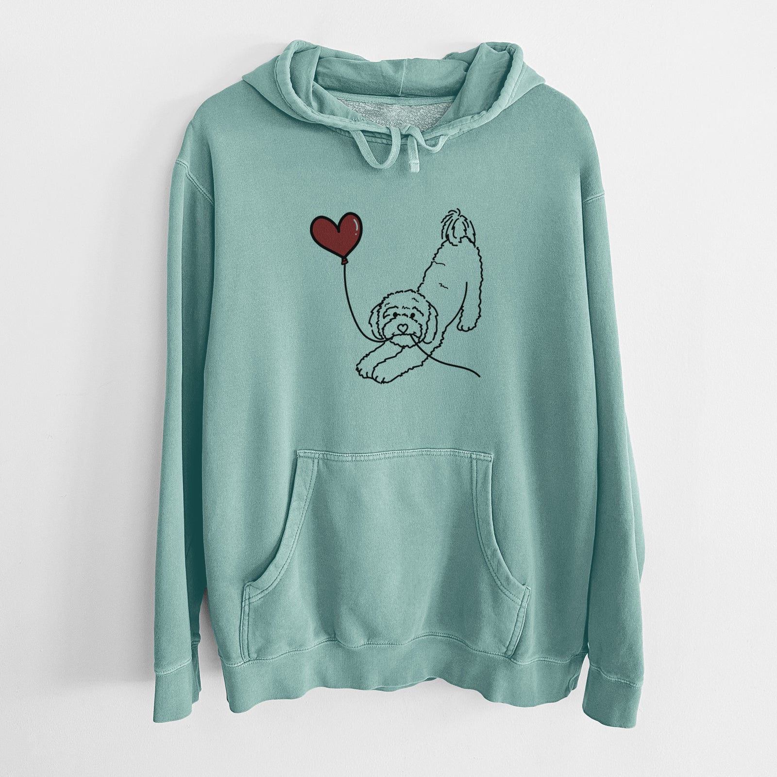 Minimalist line drawing of a Cavapoo Heart String holding a heart balloon on a Mint Unisex pigment dyed hoodie