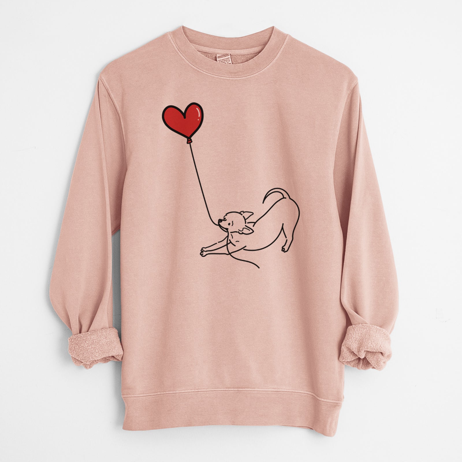 Minimalist line drawing of a Chihuahua Heart String holding a heart balloon on a Dusty Pink Unisex pigment dyed crew sweatshirt