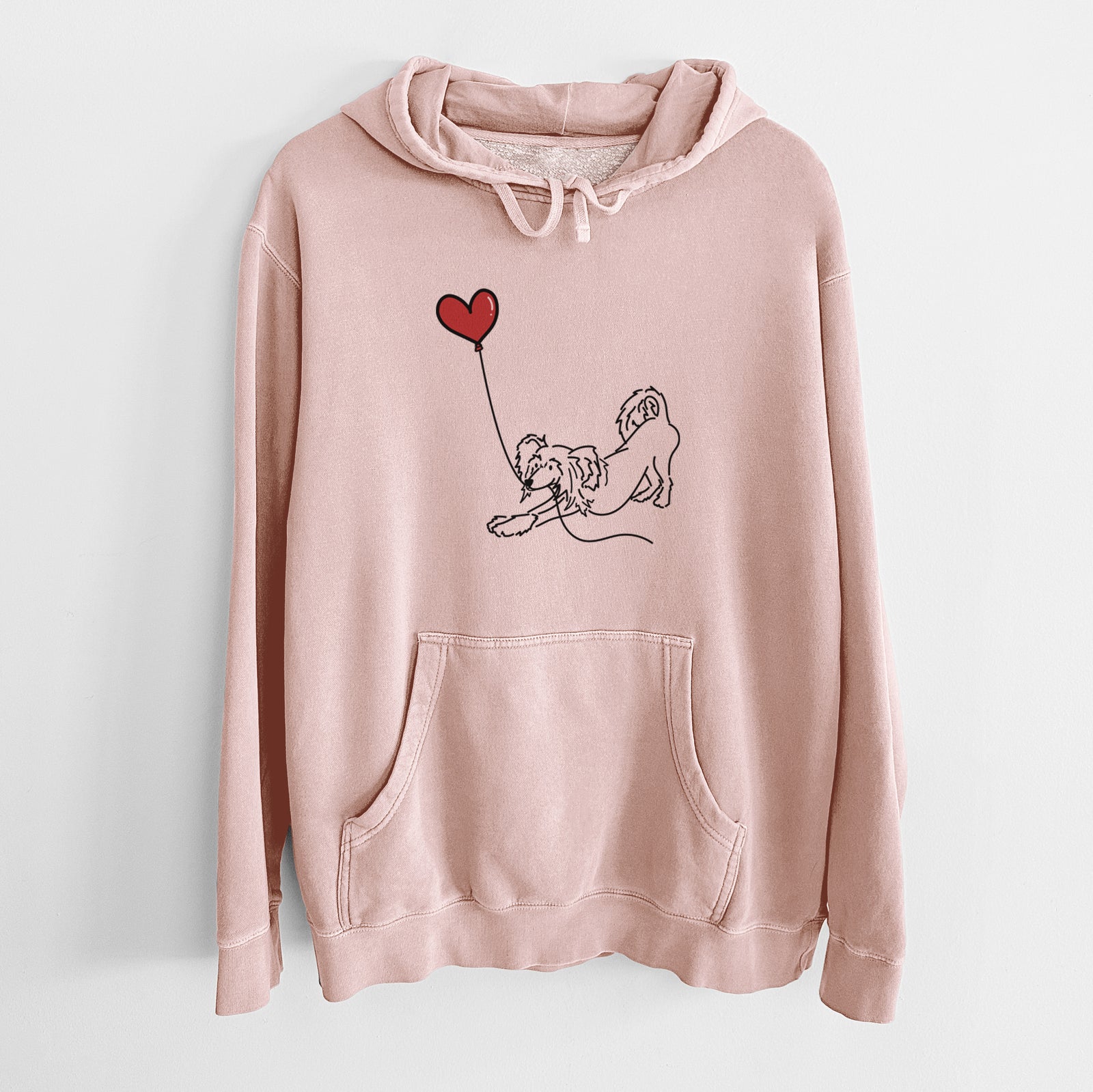 Minimalist line drawing of a Chinese Crested Heart String holding a heart balloon on a Dusty Pink Unisex pigment dyed hoodie