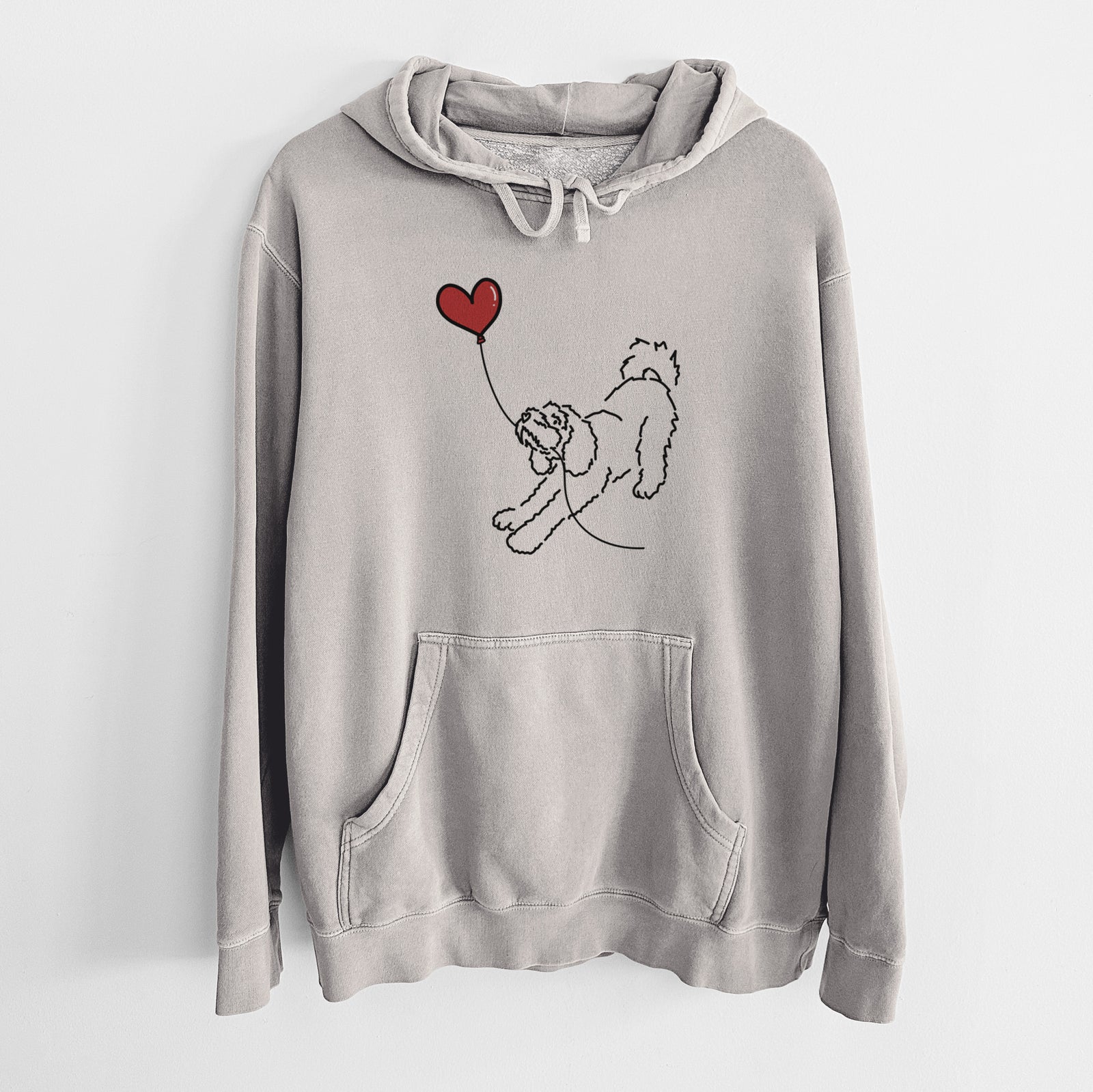 Minimalist line drawing of a Cockapoo Heart String holding a heart balloon on a Cement Unisex pigment dyed hoodie