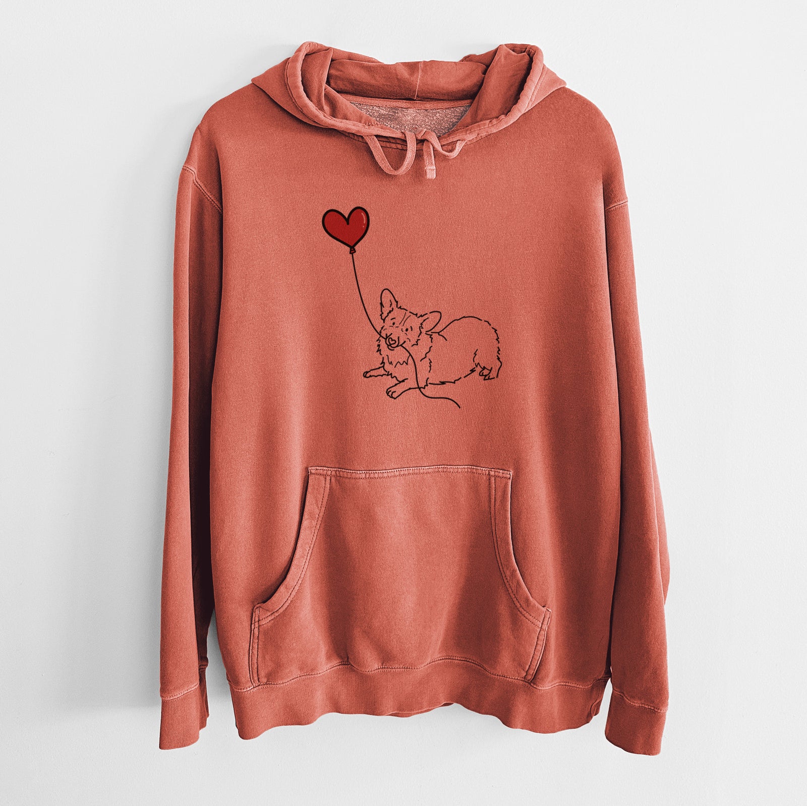 Minimalist line drawing of a Corgi Heart String holding a heart balloon on an Amber Unisex pigment dyed hoodie