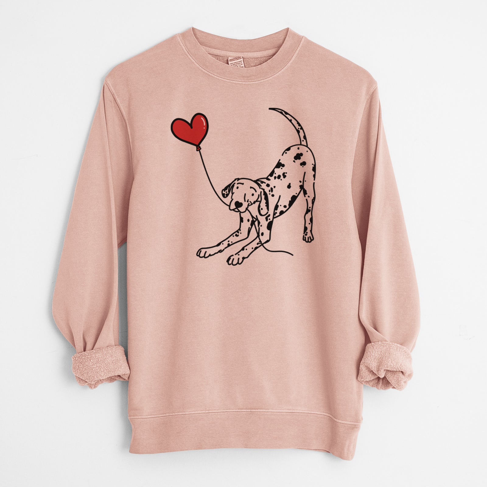 Minimalist line drawing of a Dalmatian Heart String holding a heart balloon on a Dusty Pink Unisex pigment dyed crew sweatshirt