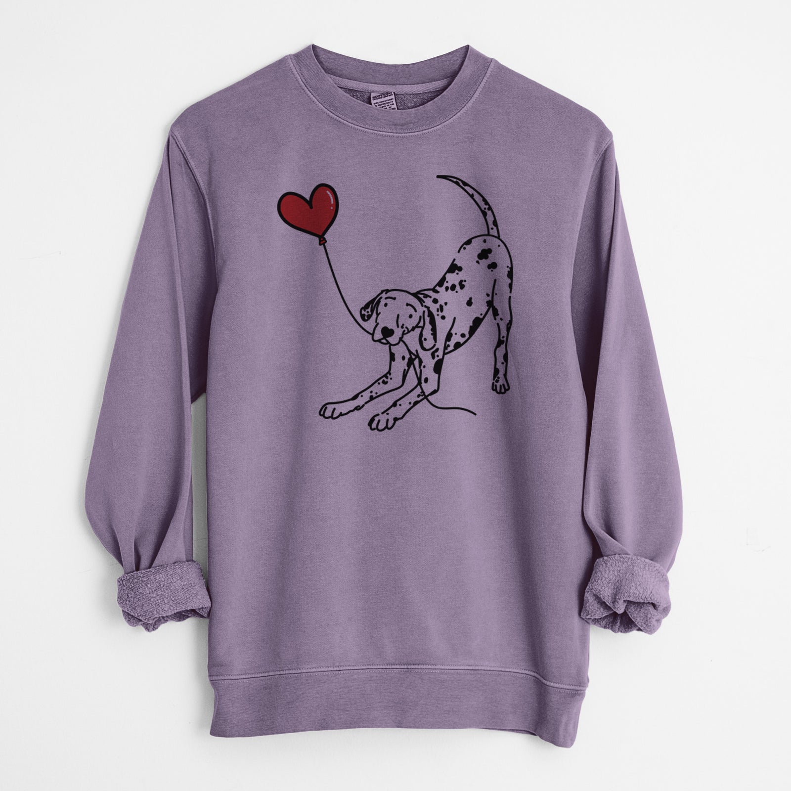 Minimalist line drawing of a Dalmatian Heart String holding a heart balloon on a Plum Unisex pigment dyed crew sweatshirt