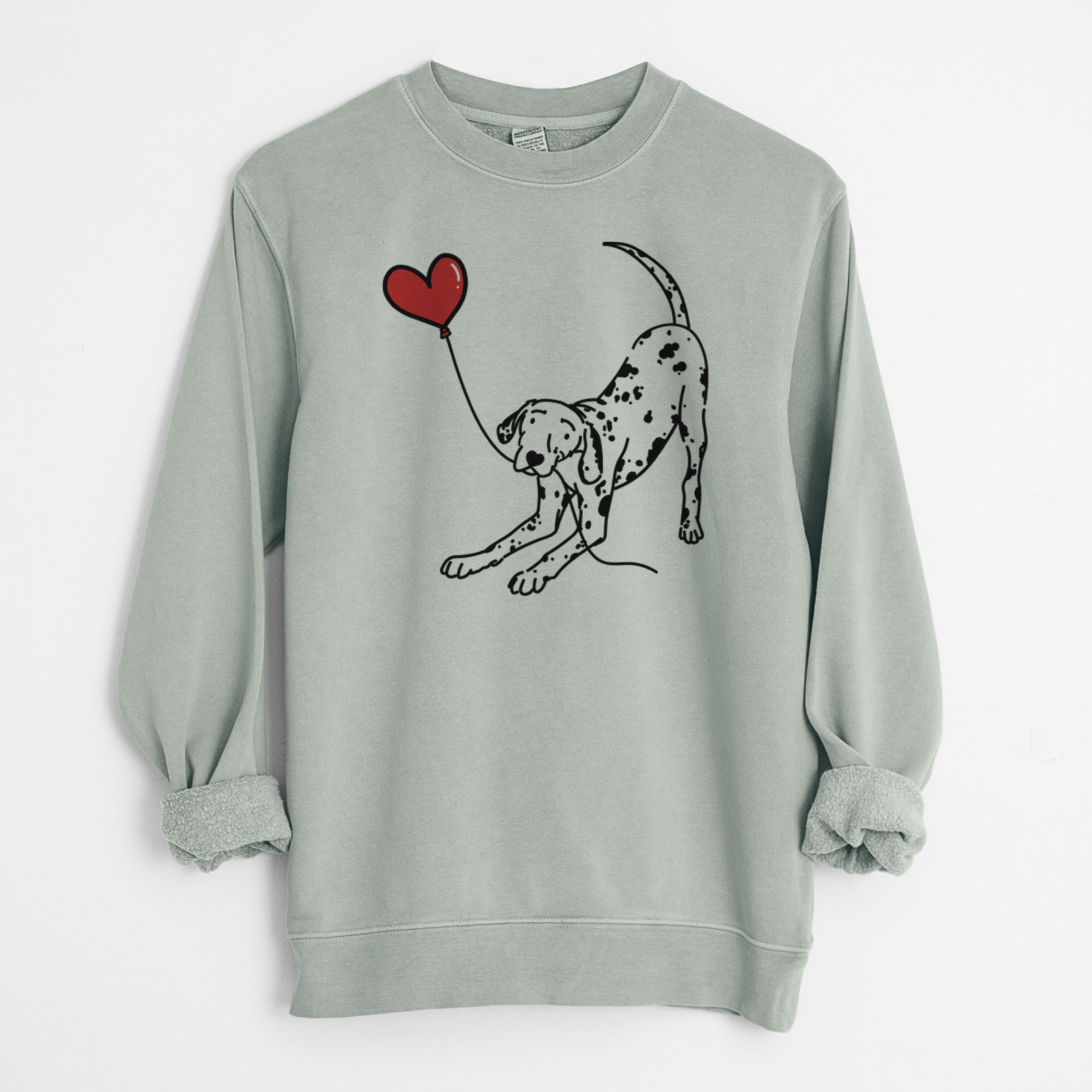 Minimalist line drawing of a Dalmatian Heart String holding a heart balloon on a Sage Unisex pigment dyed crew sweatshirt
