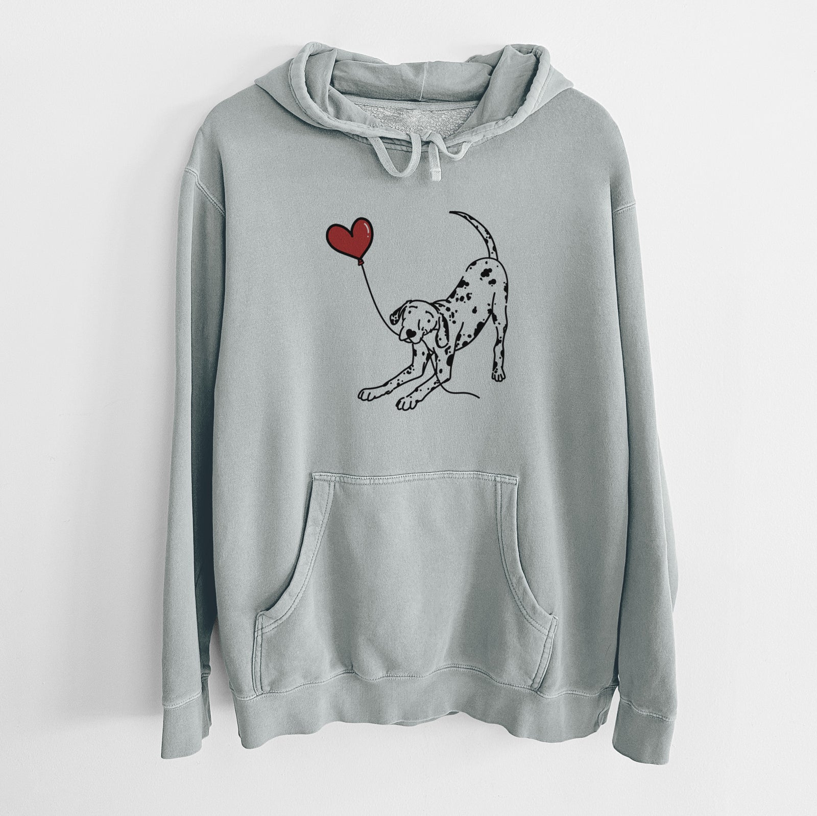 Minimalist line drawing of a Dalmatian Heart String holding a heart balloon on a Sage Unisex pigment dyed hoodie