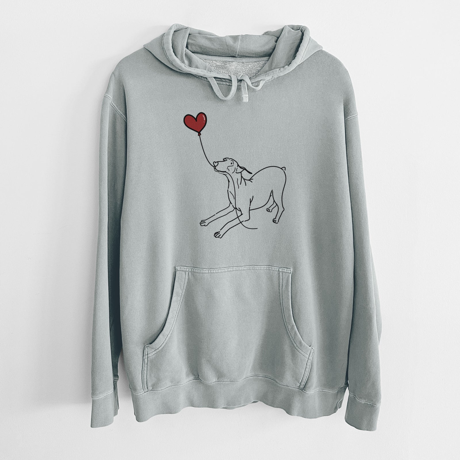 Minimalist line drawing of a Doberman Pinscher Docked Heart String holding a heart balloon on a Sage Unisex pigment dyed hoodie