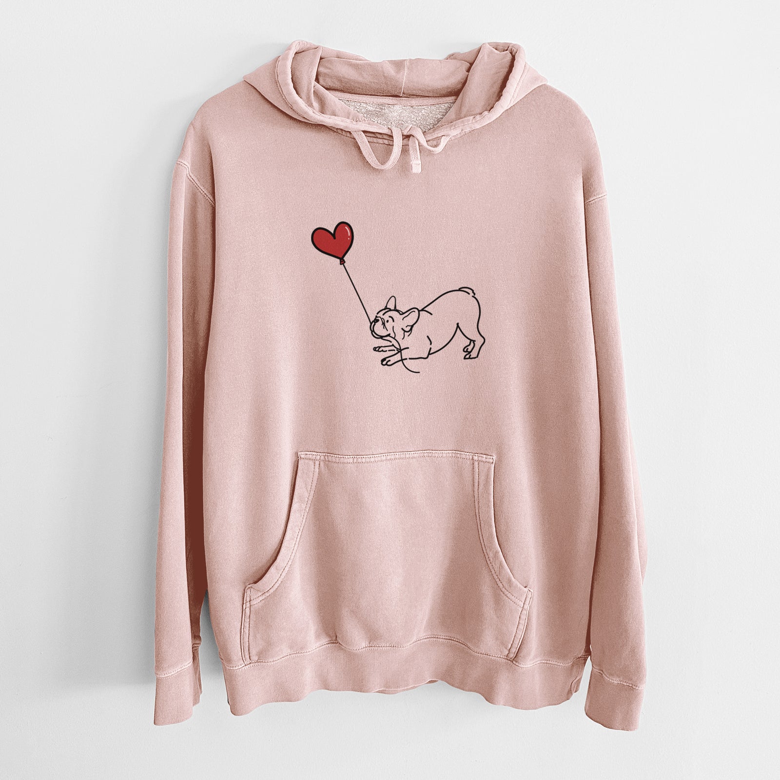Minimalist line drawing of a Frenchie Heart String holding a heart balloon on a Dusty Pink Unisex pigment dyed hoodie