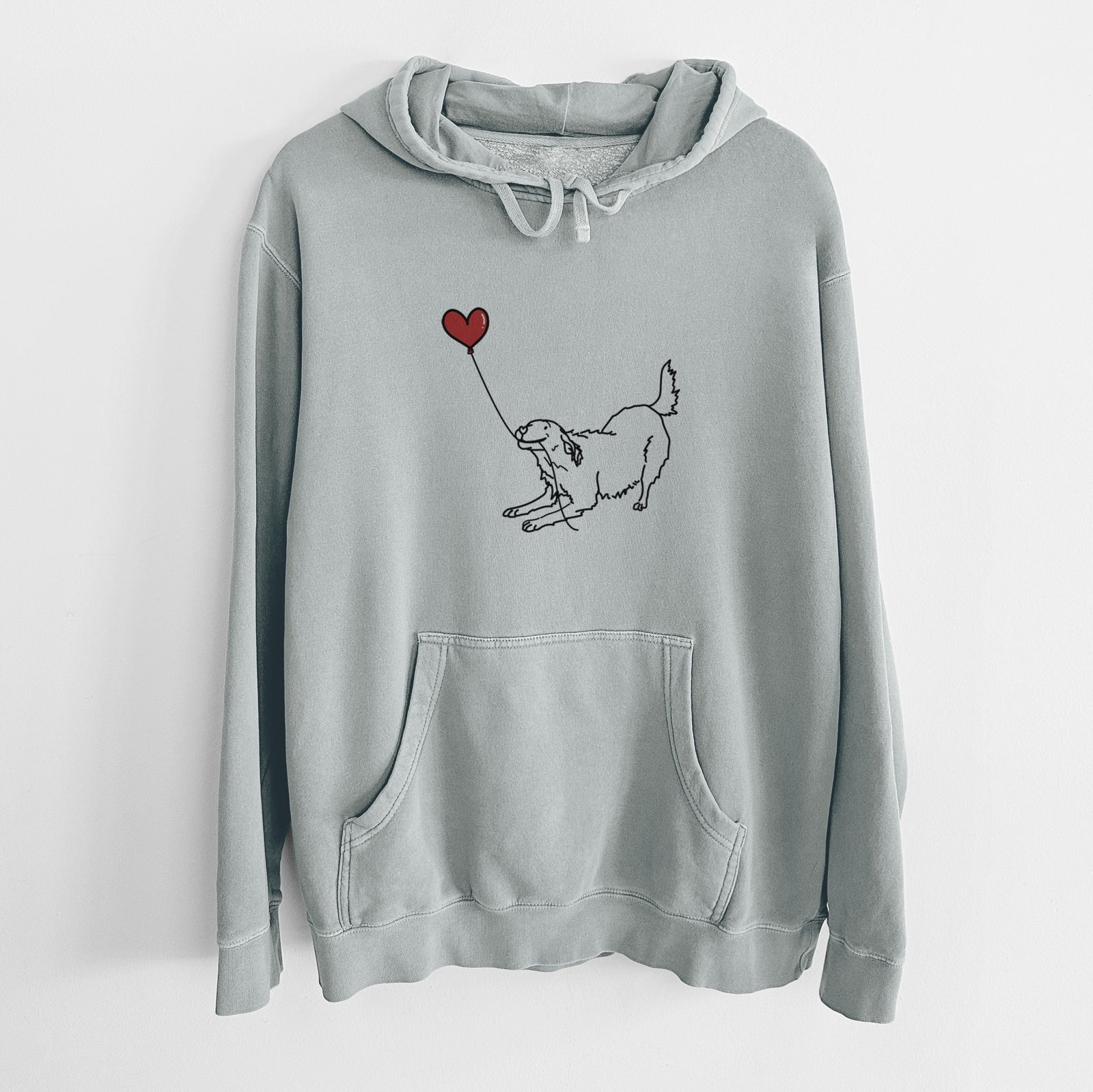Minimalist line drawing of a Golden Retriever Heart String holding a heart balloon on a Sage Unisex pigment dyed hoodie