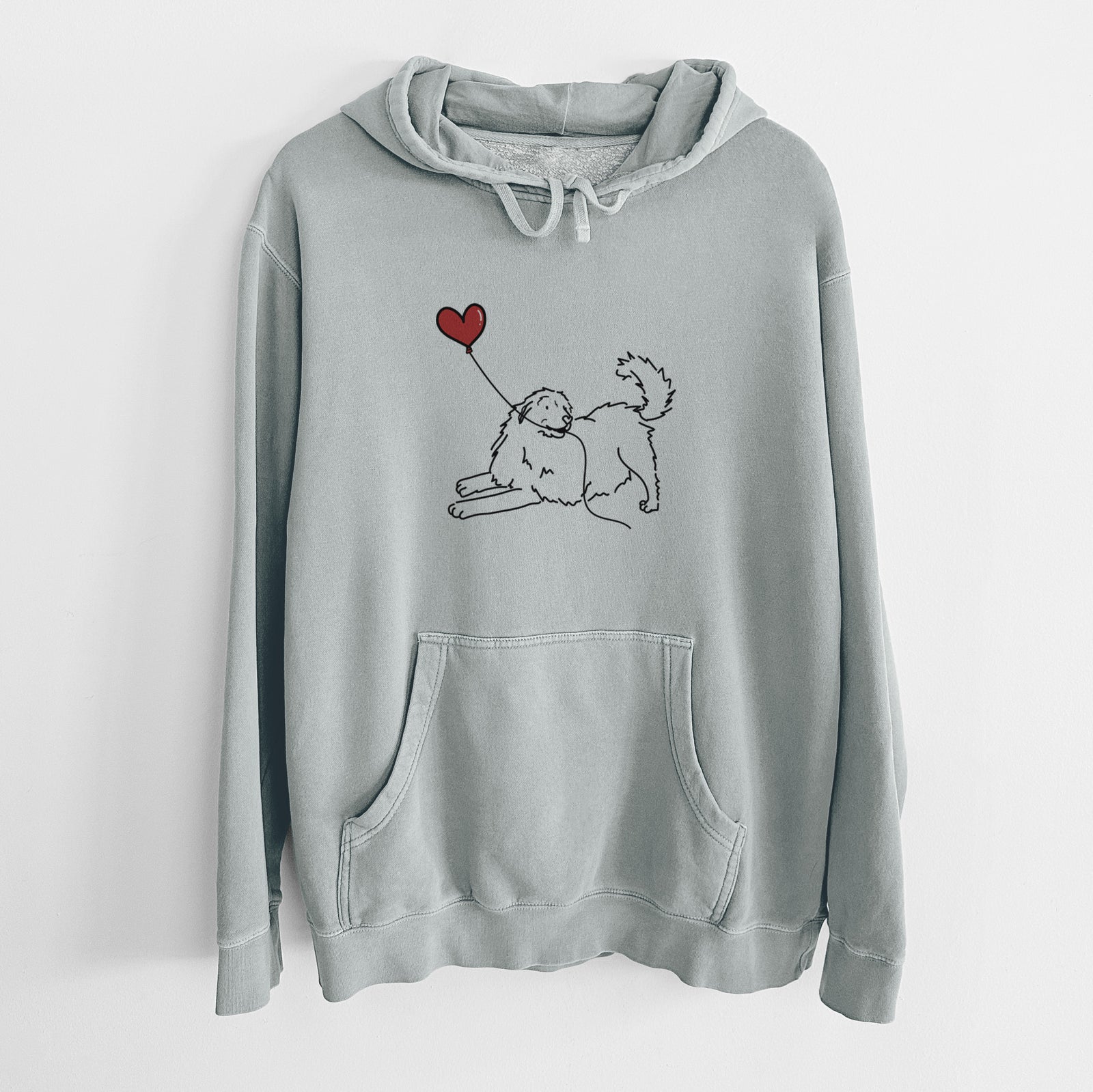 Minimalist line drawing of a Great Pyrenees Heart String holding a heart balloon on a Sage Unisex pigment dyed hoodie