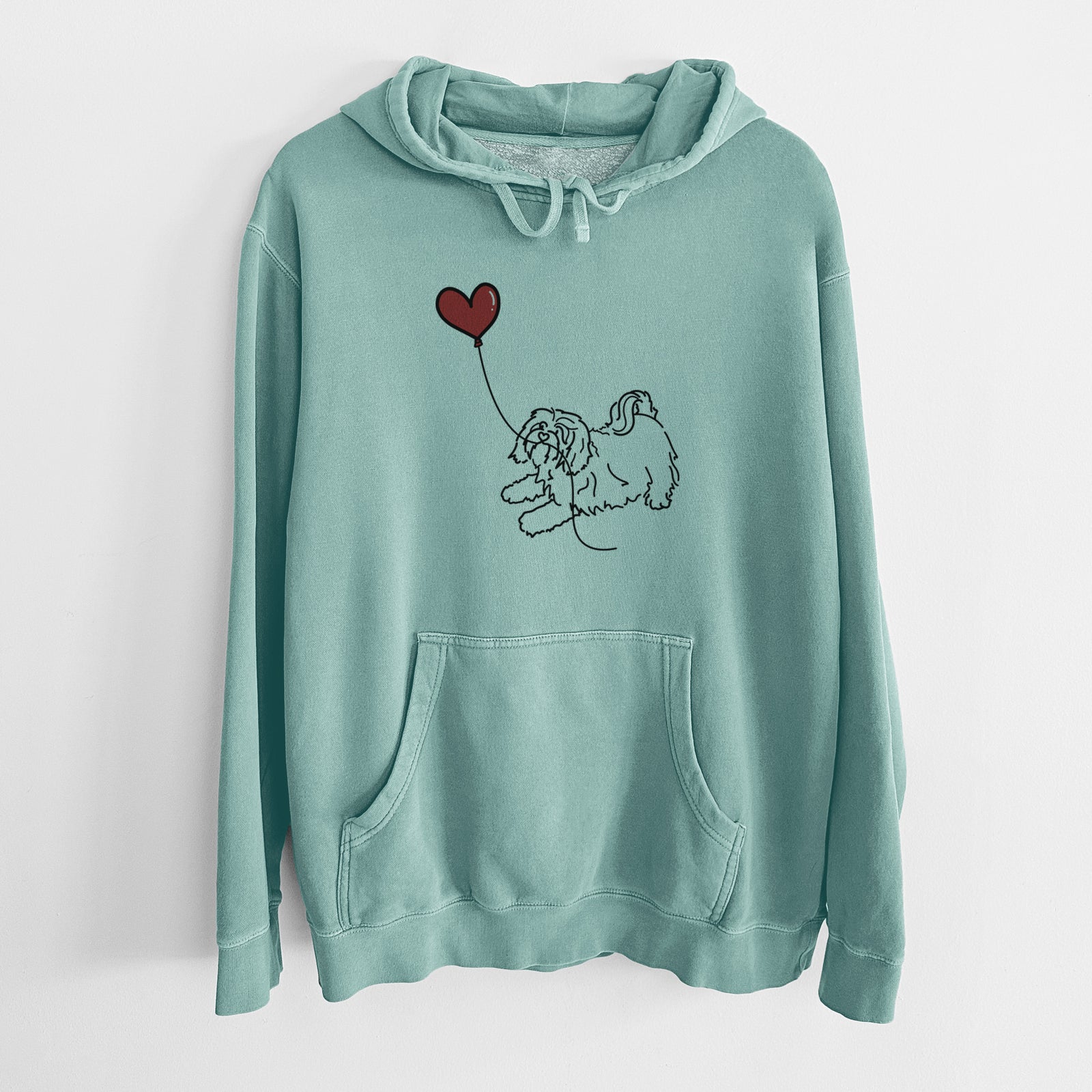 Minimalist line drawing of a Havanese Heart String holding a heart balloon on a Mint Unisex pigment dyed hoodie