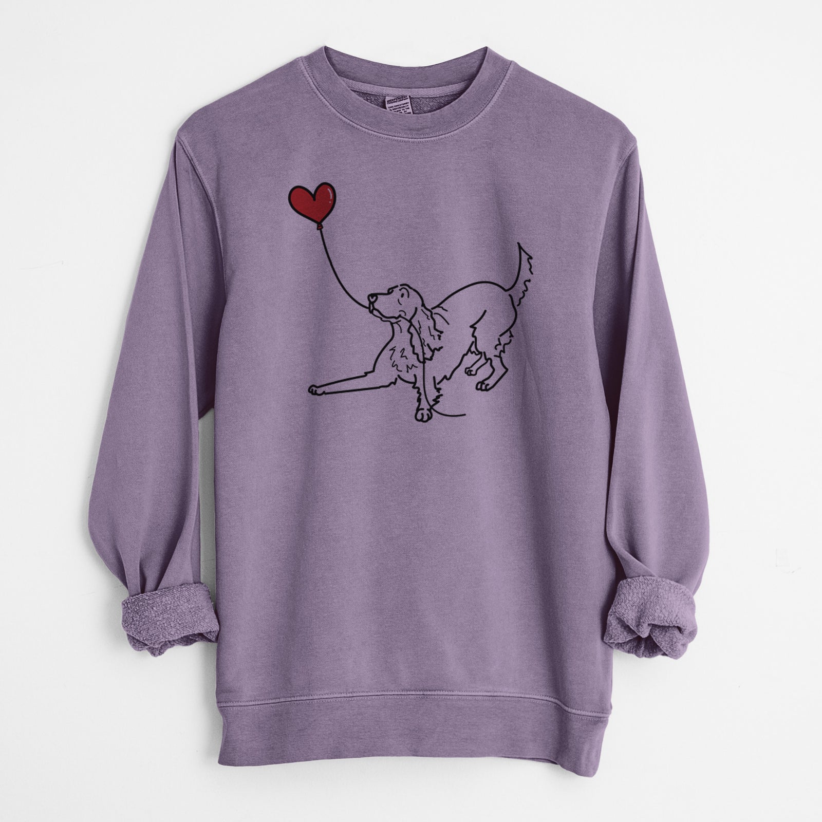Minimalist line drawing of an Irish Setter Heart String holding a heart balloon on a Plum Unisex pigment dyed crew sweatshirt