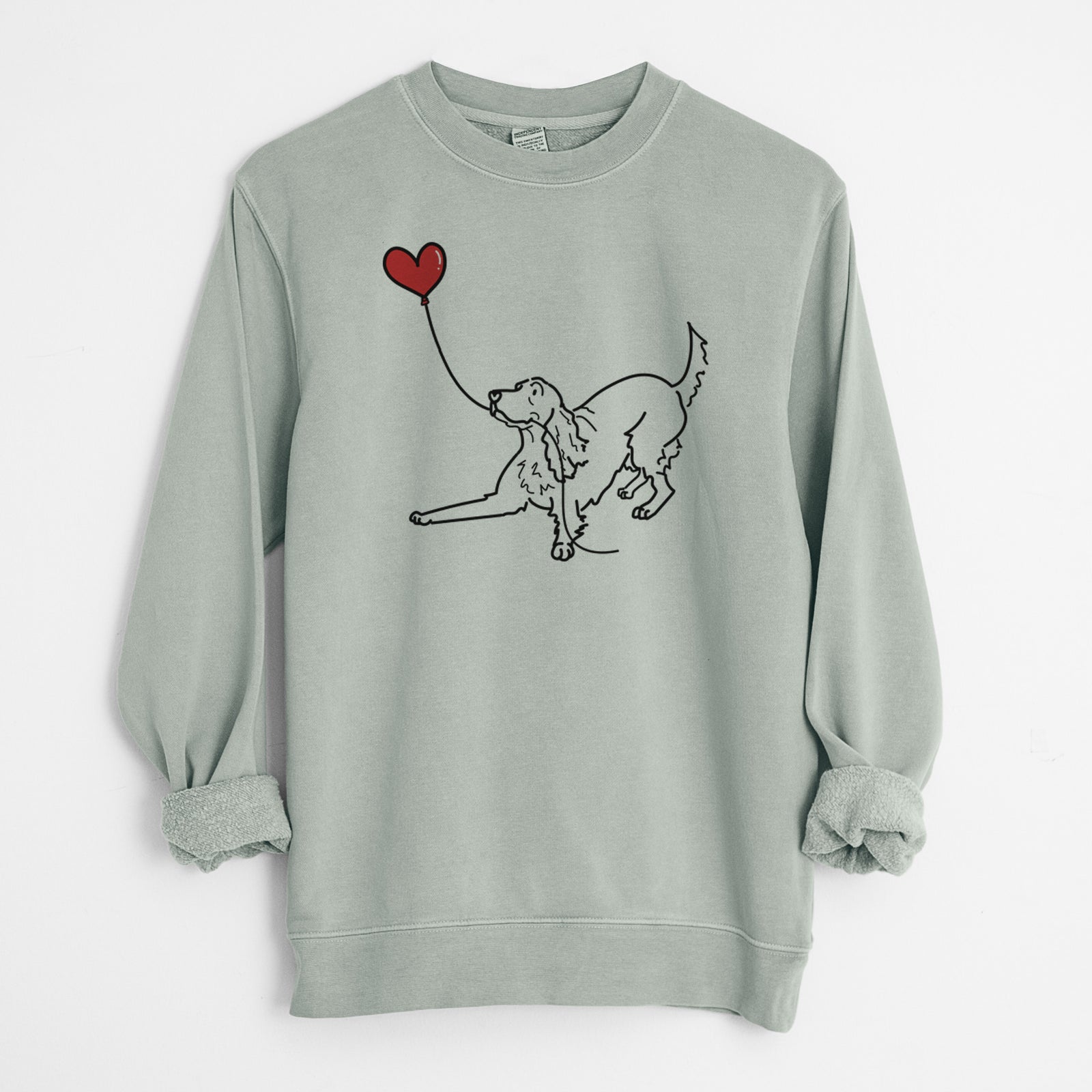 Minimalist line drawing of an Irish Setter Heart String holding a heart balloon on a Sage Unisex pigment dyed crew sweatshirt