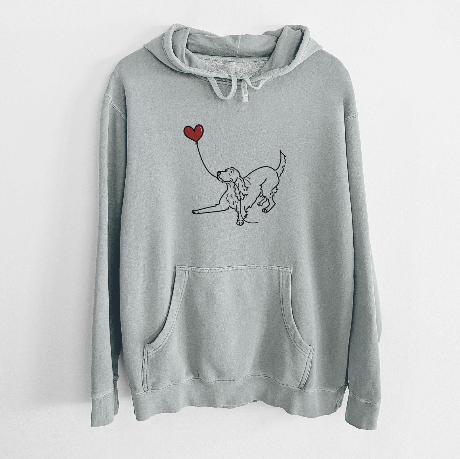 Minimalist line drawing of an Irish Setter Heart String holding a heart balloon on a Sage Unisex pigment dyed hoodie
