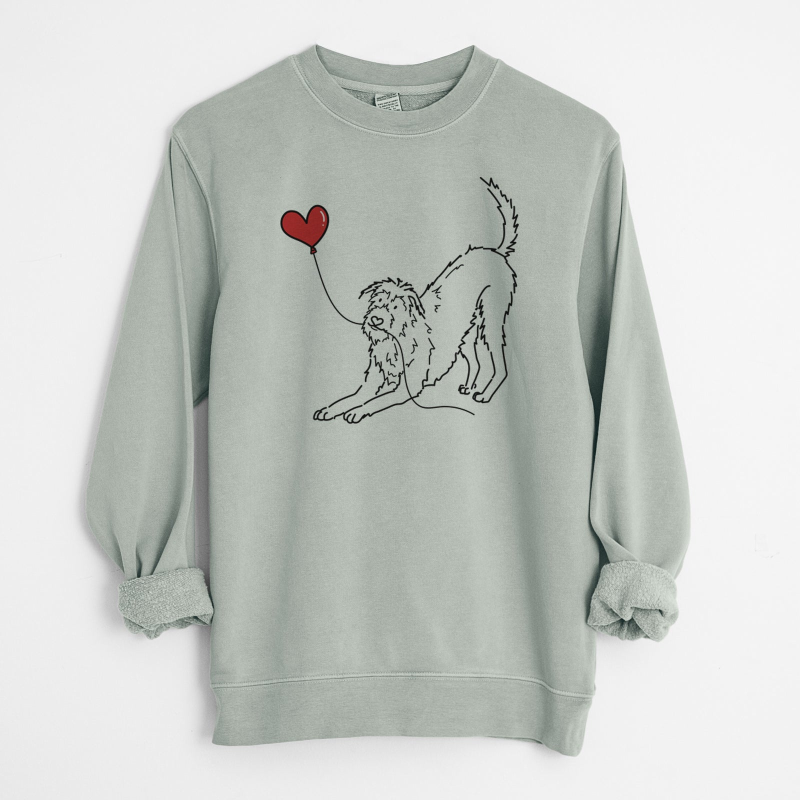 Minimalist line drawing of an Irish Wolfhound Heart String holding a heart balloon on a Sage Unisex pigment dyed crew sweatshirt