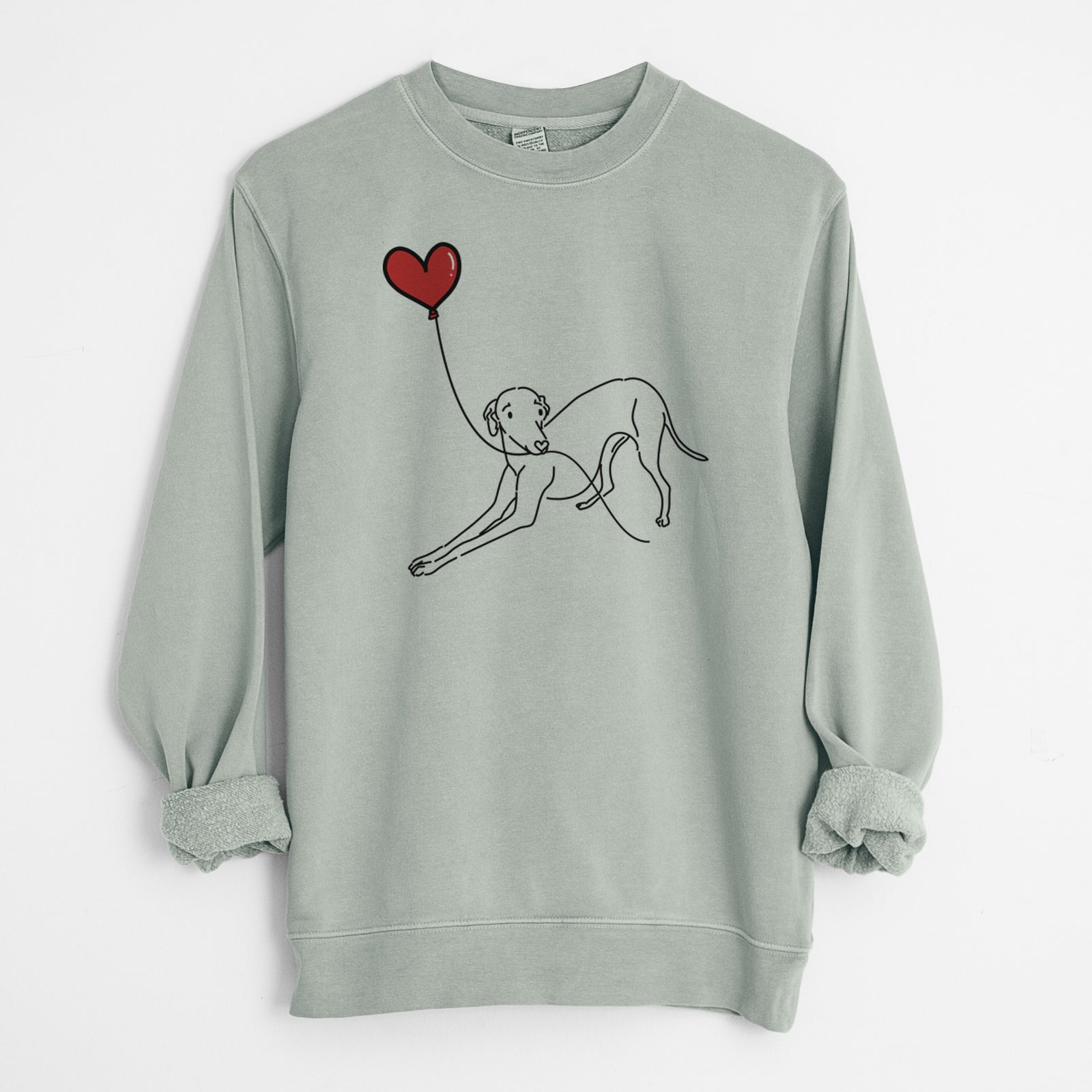 Minimalist line drawing of an Italian Greyhound Heart String holding a heart balloon on a Sage Unisex pigment dyed crew sweatshirt