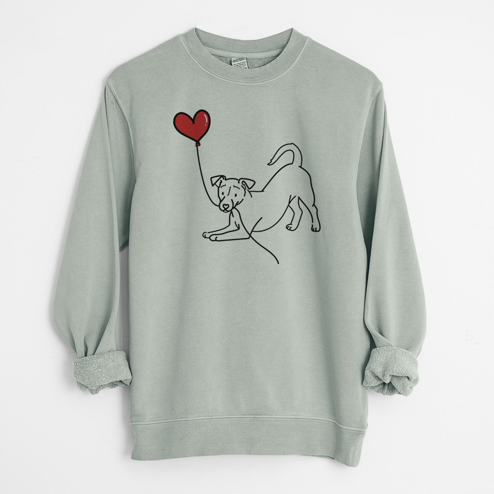 Minimalist line drawing of a Jack Russell Terrier Heart String holding a heart balloon on a Sage Unisex pigment dyed crew sweatshirt