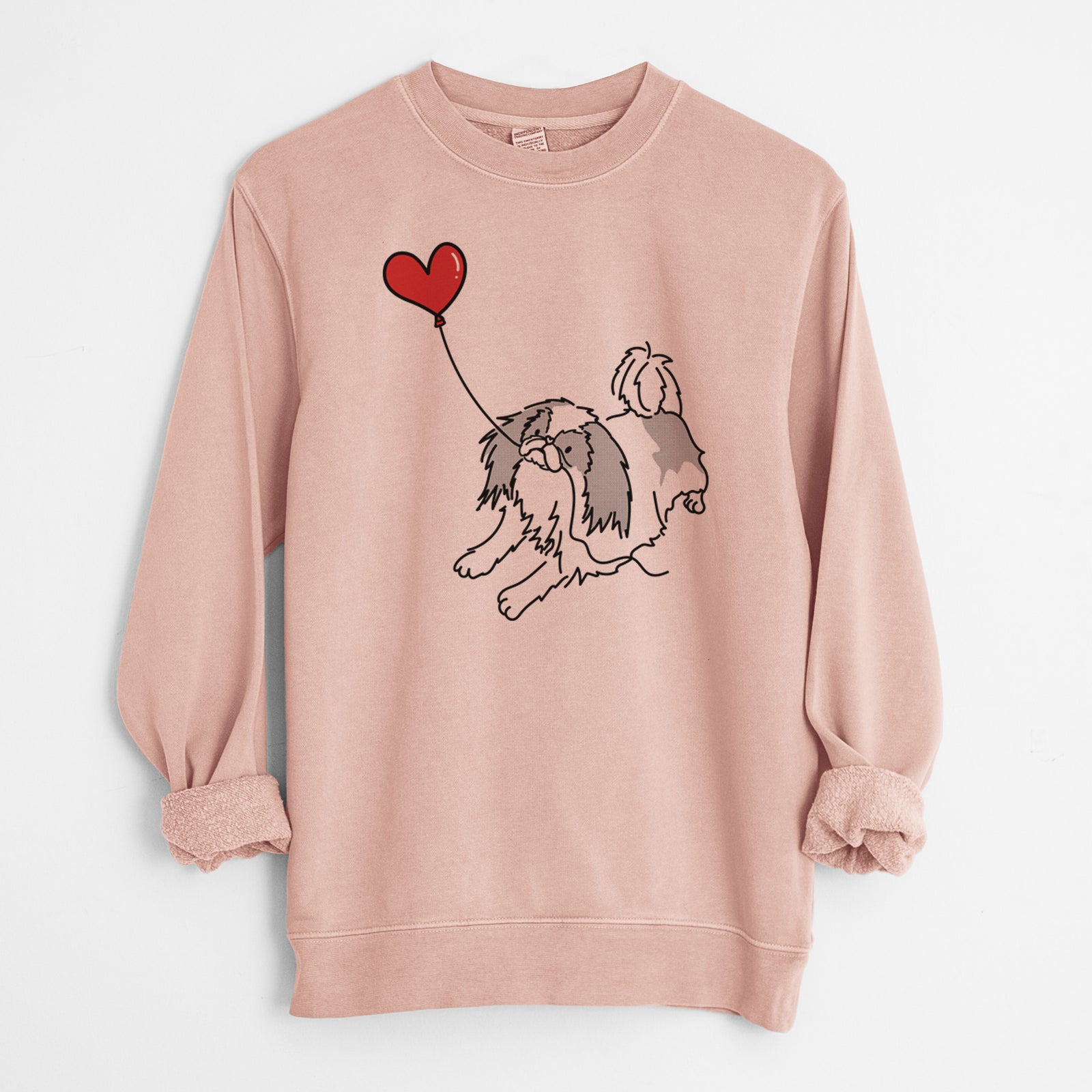Minimalist line drawing of a Japanese Chin Heart String holding a heart balloon on a Dusty Pink Unisex pigment dyed crew sweatshirt
