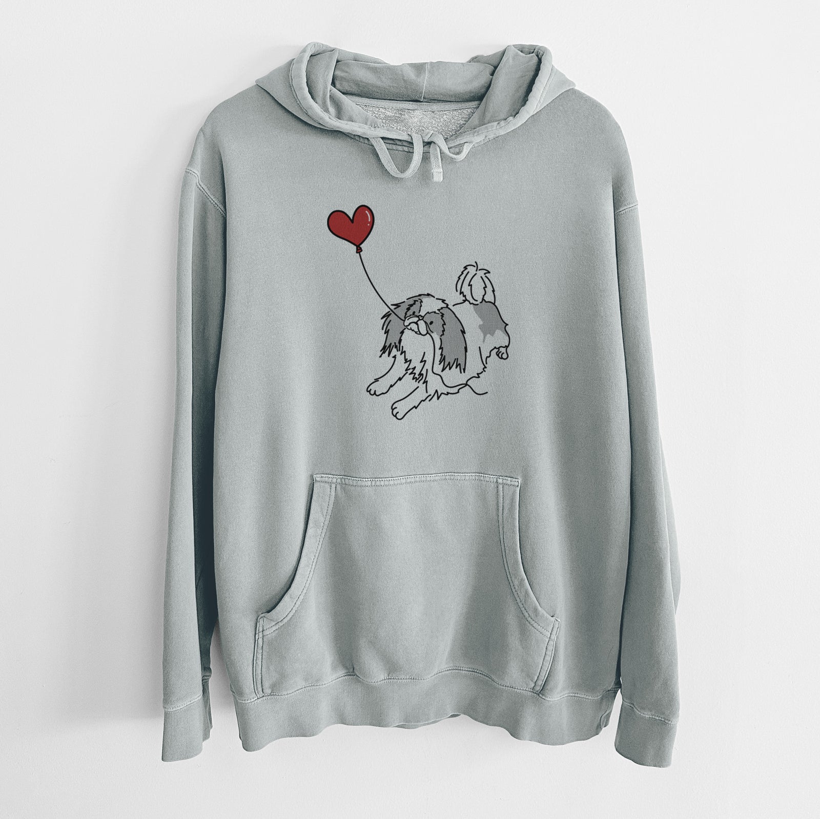 Minimalist line drawing of a Japanese Chin Heart String holding a heart balloon on a Sage Unisex pigment dyed hoodie