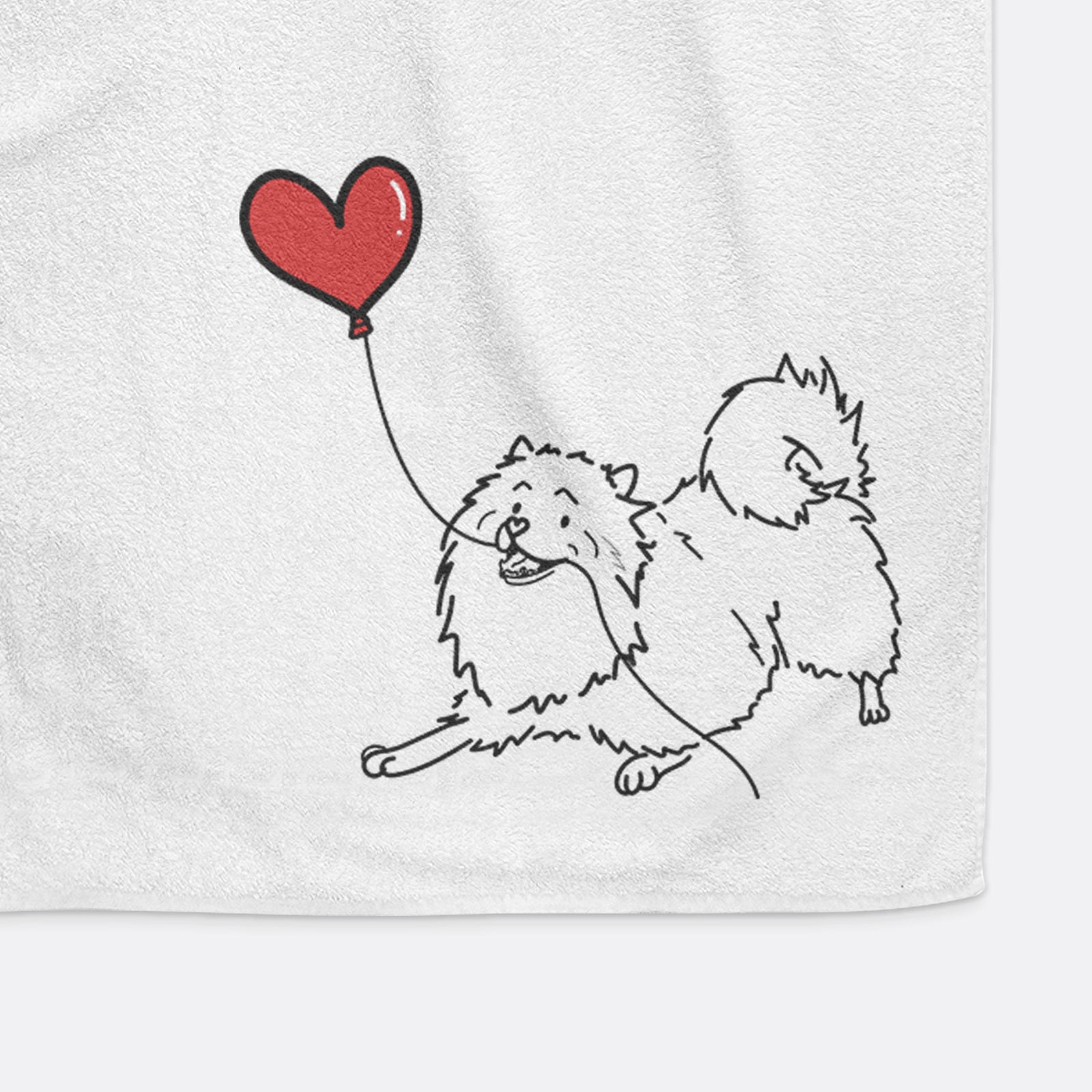 Minimalist line drawing of a Keeshond Heart String holding a heart balloon on a decorative hand towel