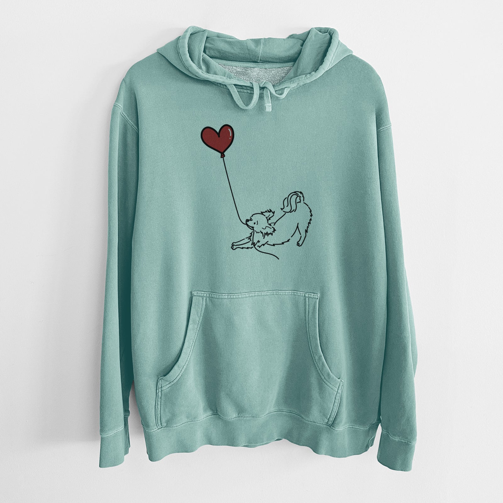 Minimalist line drawing of a Long Haired Chihuahua Heart String holding a heart balloon on a Mint Unisex pigment dyed hoodie