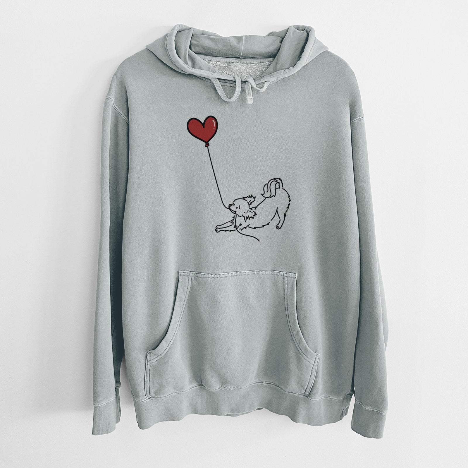 Minimalist line drawing of a Long Haired Chihuahua Heart String holding a heart balloon on a Sage Unisex pigment dyed hoodie