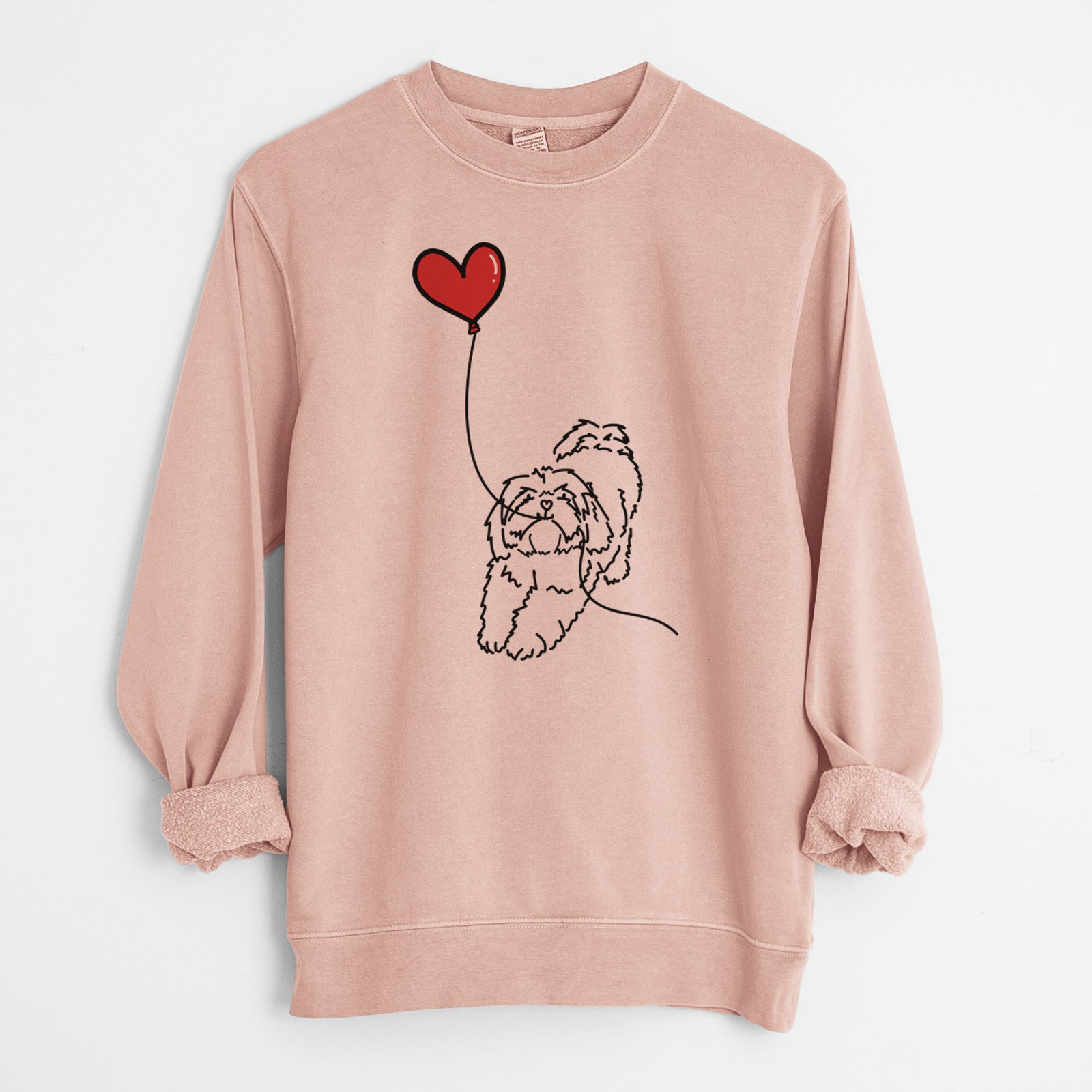 Minimalist line drawing of a Lhasa Apso Heart String holding a heart balloon on a Dusty Pink Unisex pigment dyed crew sweatshirt
