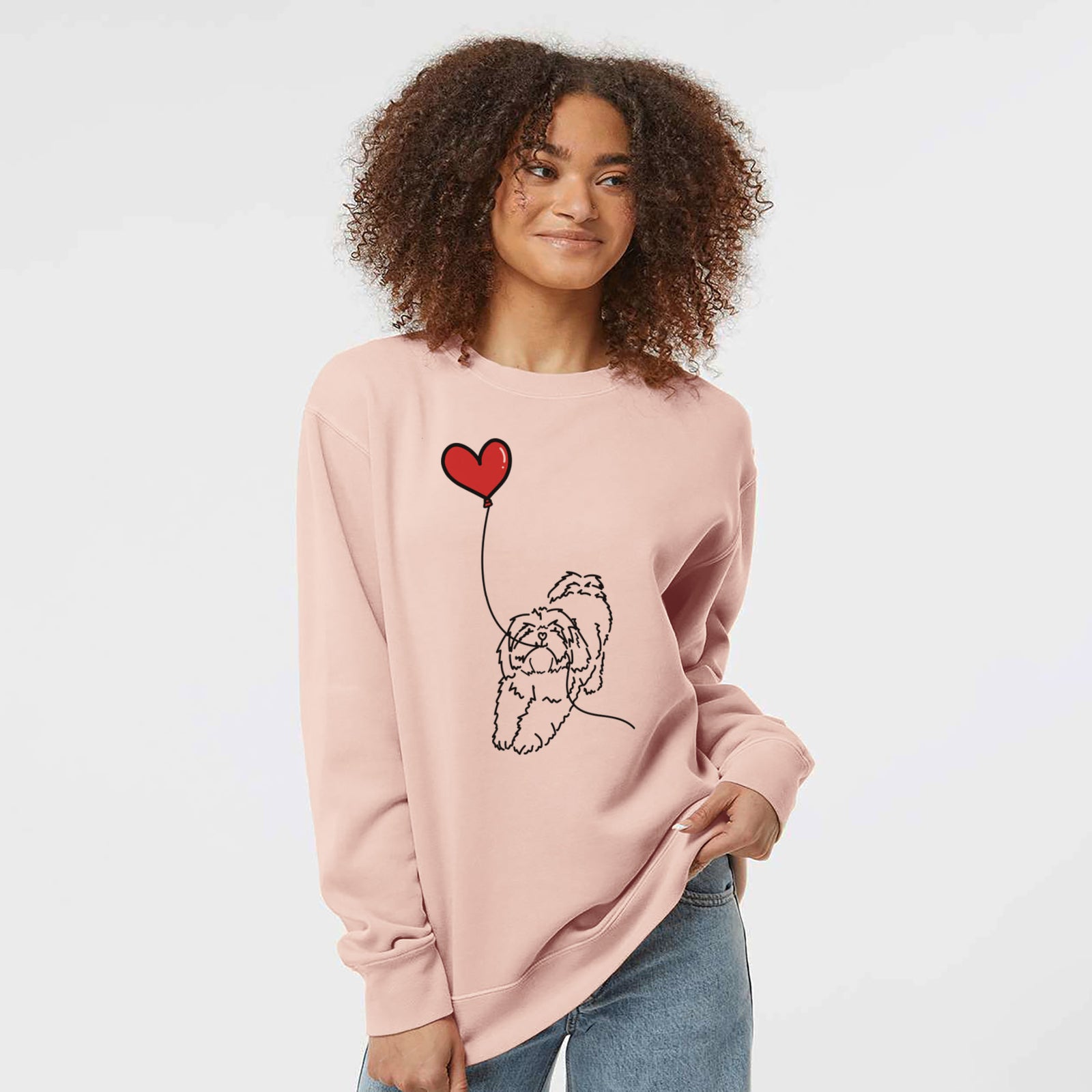 Minimalist line drawing of a Lhasa Apso Heart String holding a heart balloon on a Dusty Pink Unisex pigment dyed crew sweatshirt