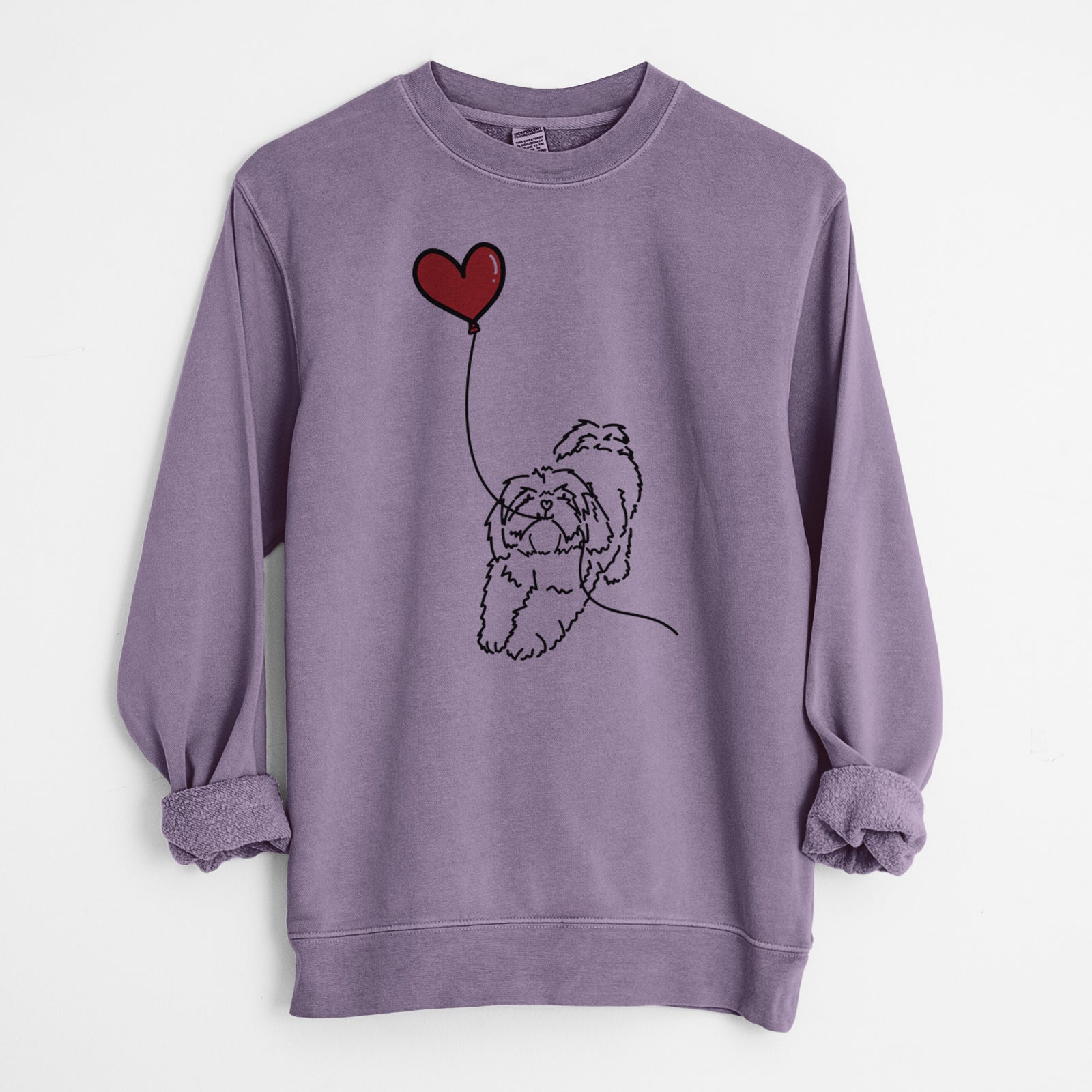 Minimalist line drawing of a Lhasa Apso Heart String holding a heart balloon on a Plum Unisex pigment dyed crew sweatshirt