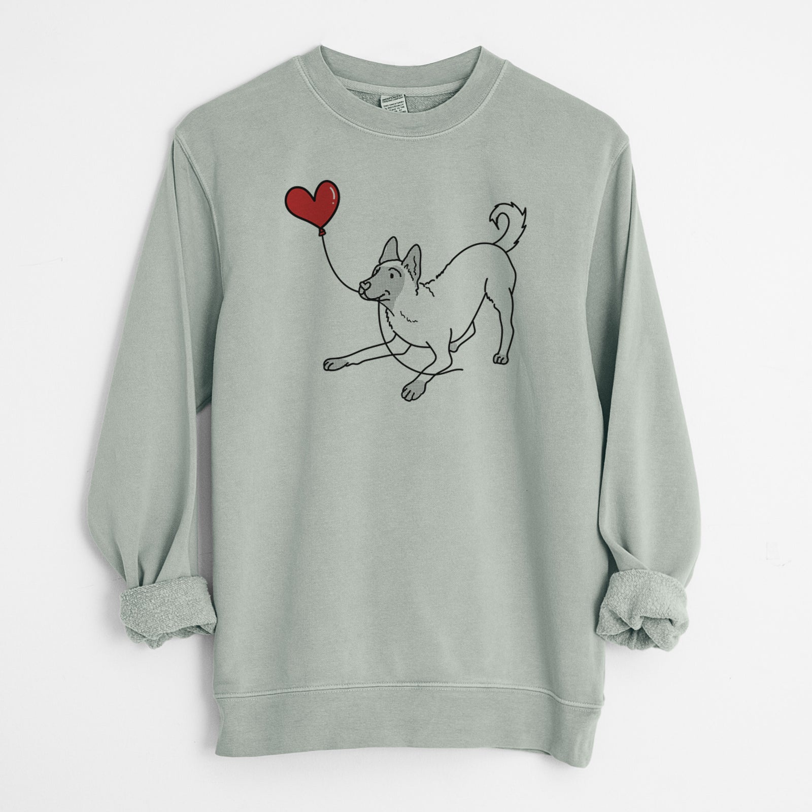Minimalist line drawing of a Belgian Malinois Heart String holding a heart balloon on a Sage Unisex pigment dyed crew sweatshirt