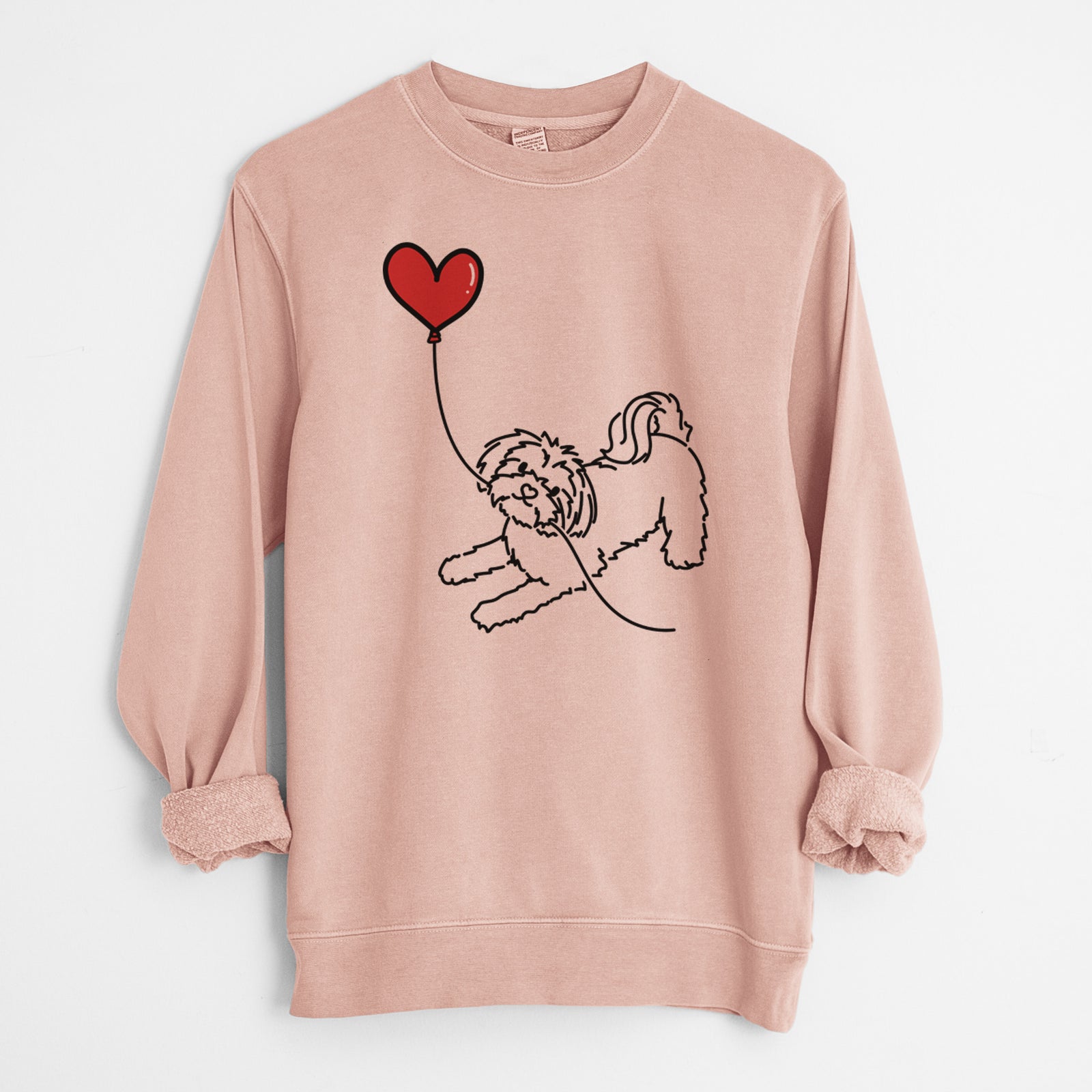 Minimalist line drawing of a Maltese Heart String holding a heart balloon on a Dusty Pink Unisex pigment dyed crew sweatshirt