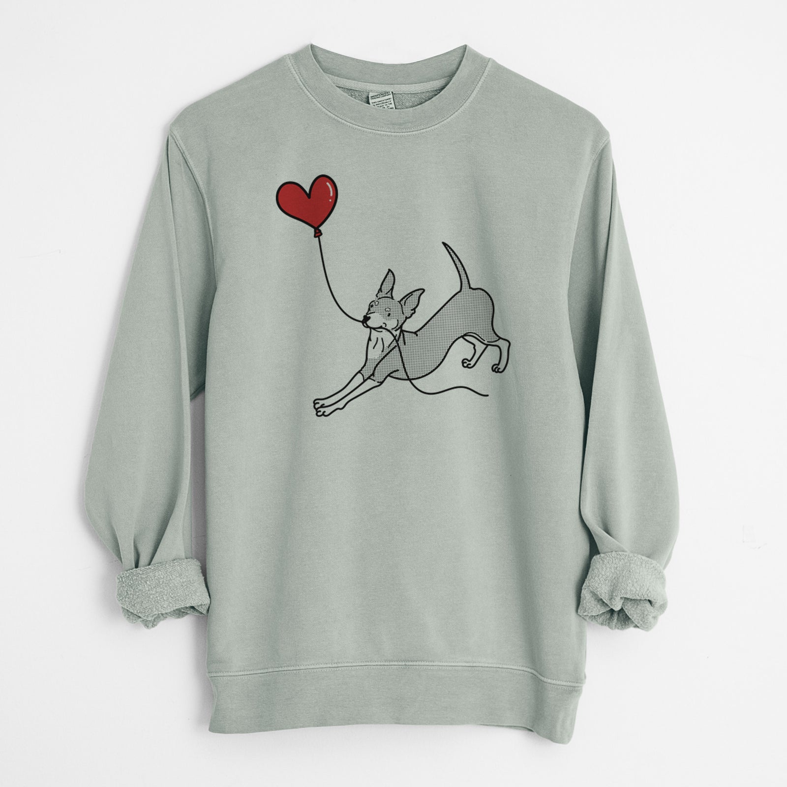 Minimalist line drawing of a Mini Pinscher Heart String holding a heart balloon on a Sage Unisex pigment dyed crew sweatshirt