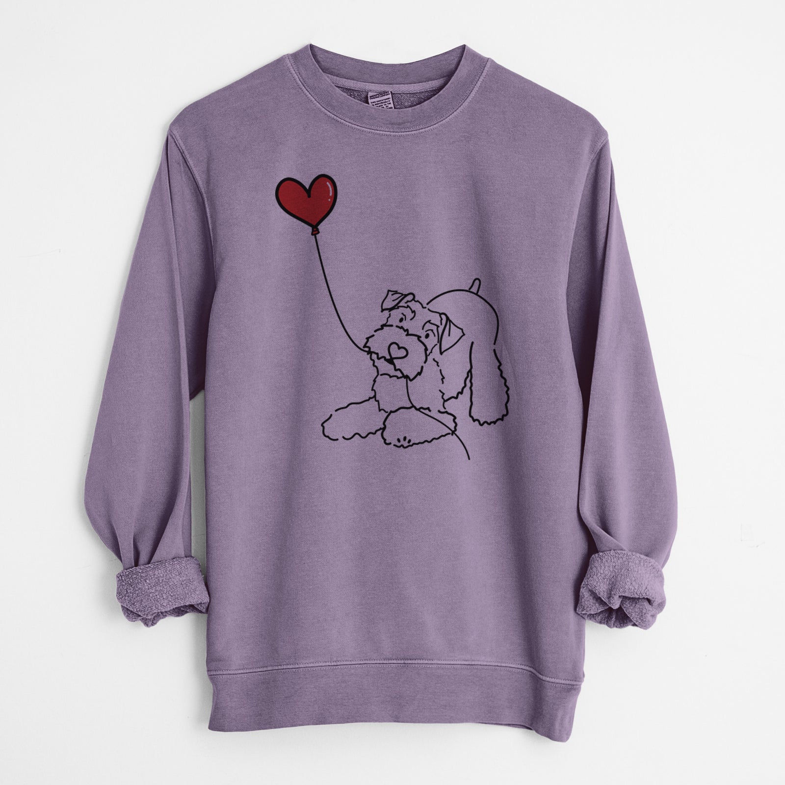 Minimalist line drawing of a Mini Schnauzer Heart String holding a heart balloon on a Plum Unisex pigment dyed crew sweatshirt