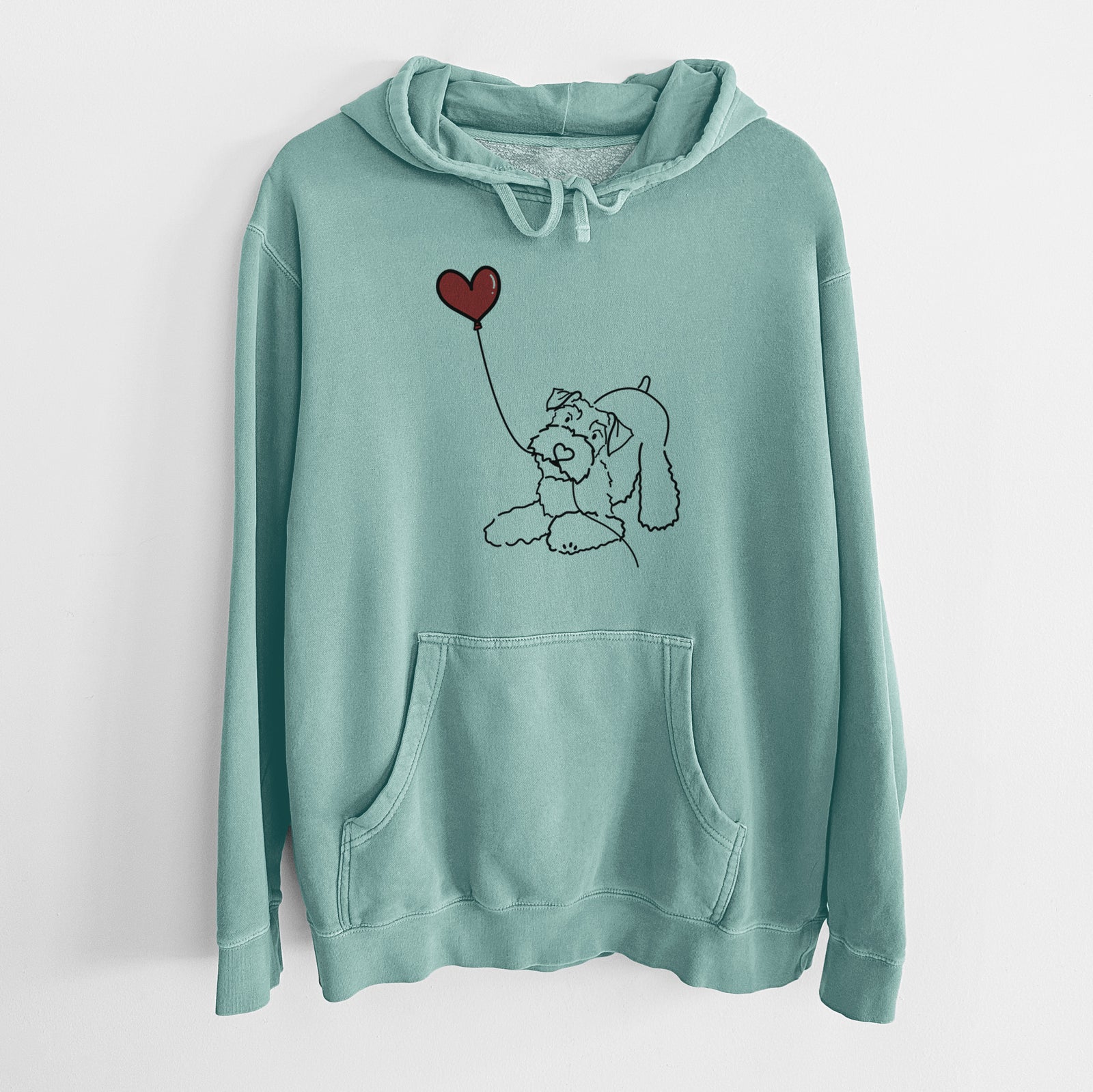 Minimalist line drawing of a Mini Schnauzer Heart String holding a heart balloon on a Mint Unisex pigment dyed hoodie