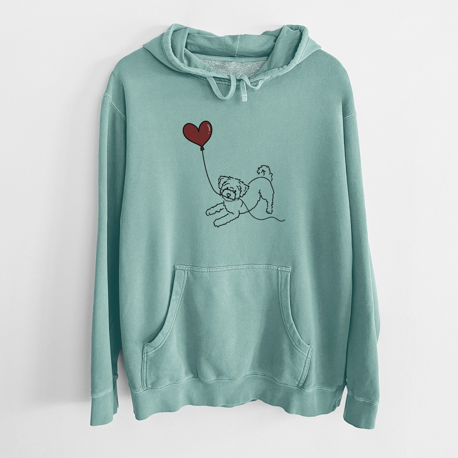 Minimalist line drawing of a Morkie Heart String holding a heart balloon on a Mint Unisex pigment dyed hoodie