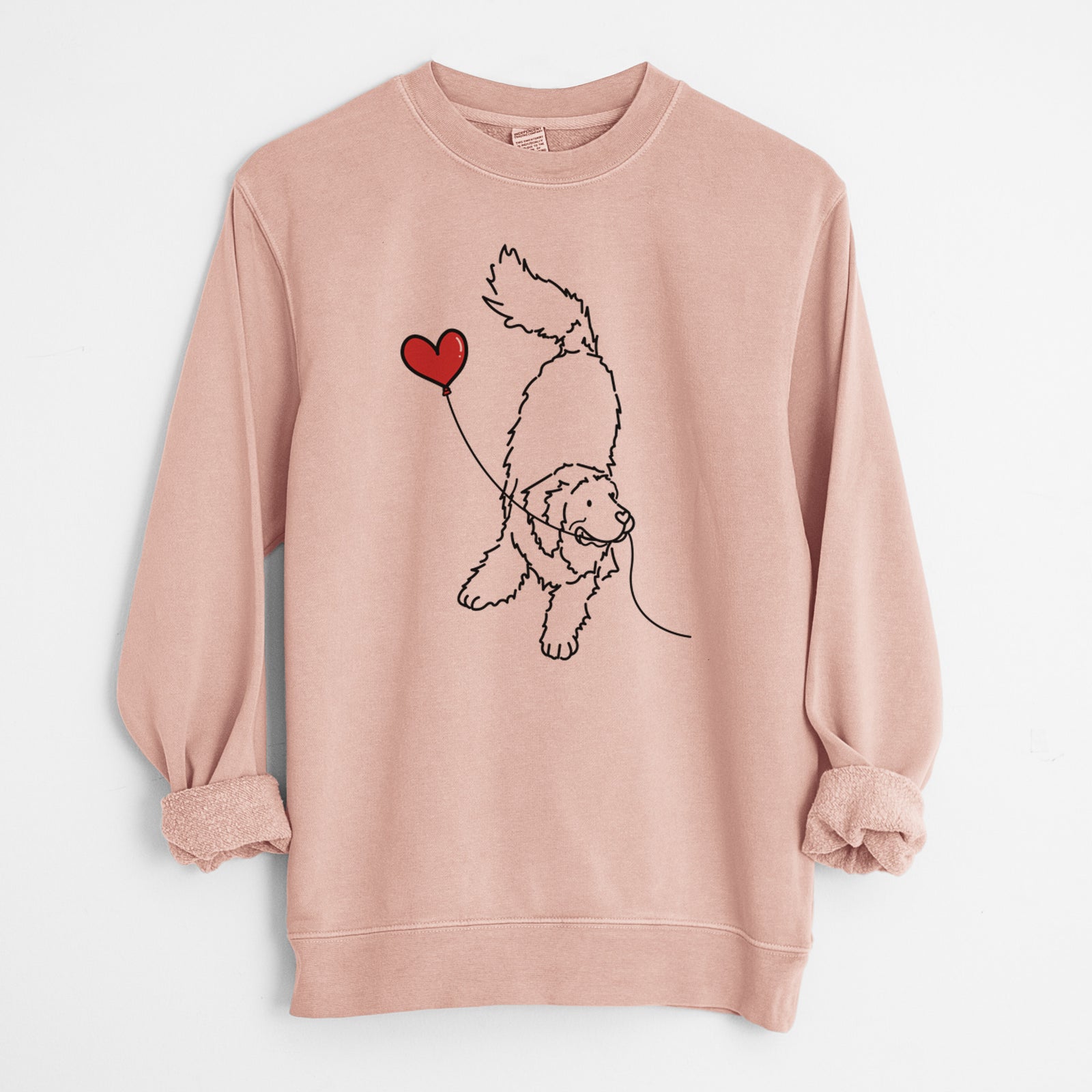Minimalist line drawing of a Newfoundland Heart String holding a heart balloon on a Dusty Pink Unisex pigment dyed crew sweatshirt
