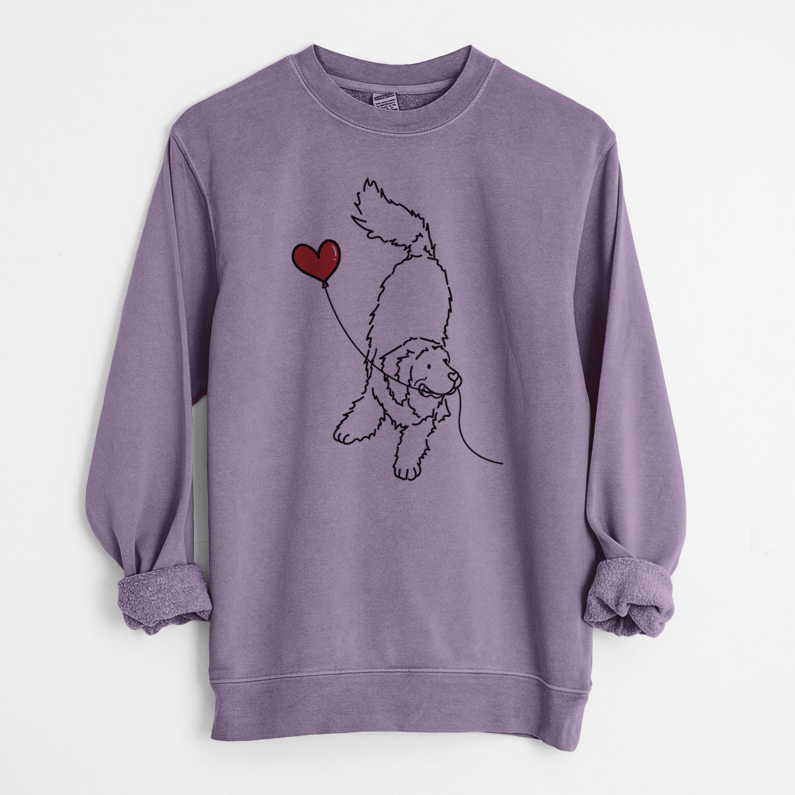 Minimalist line drawing of a Newfoundland Heart String holding a heart balloon on a Plum Unisex pigment dyed crew sweatshirt