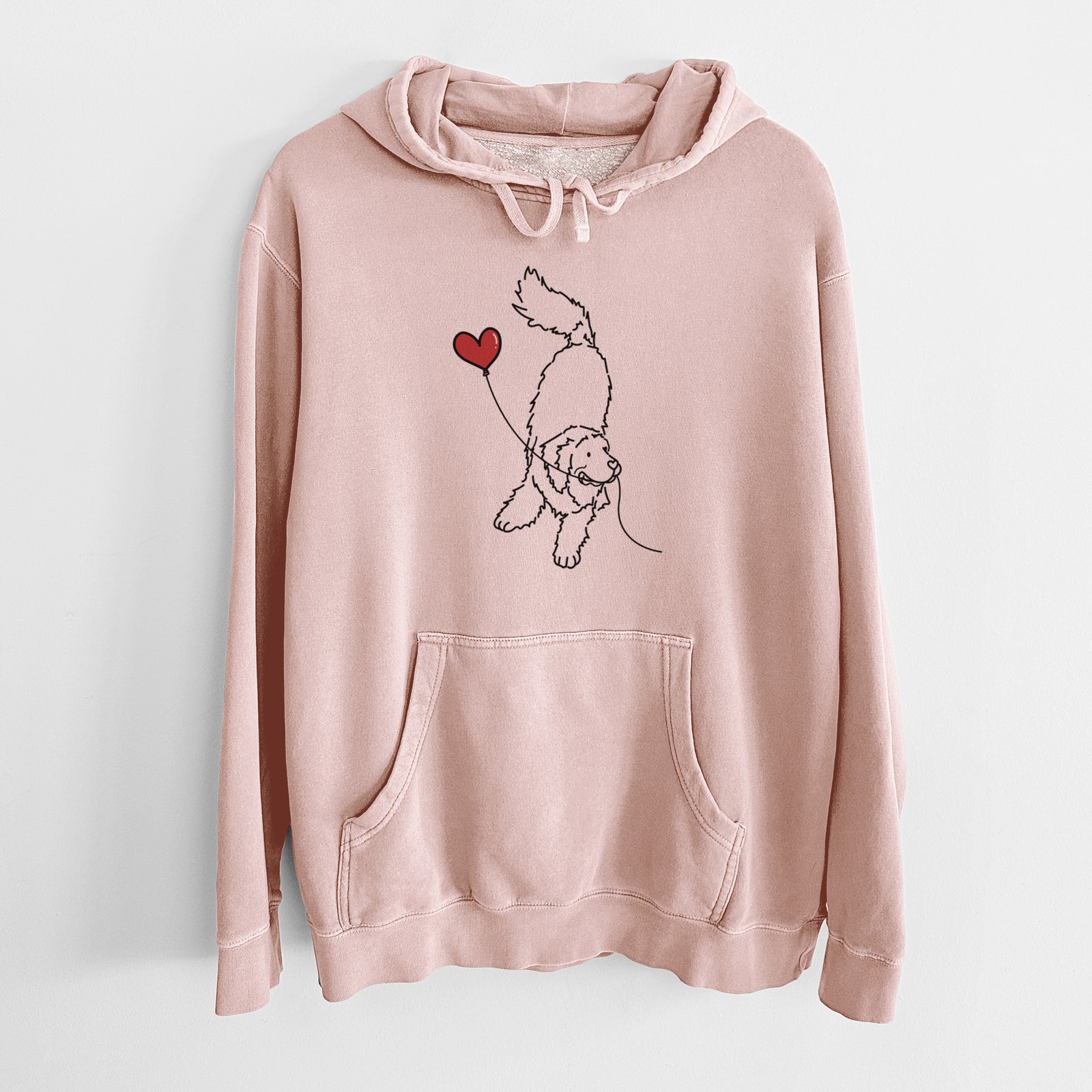 Minimalist line drawing of a Newfoundland Heart String holding a heart balloon on a Dusty Pink Unisex pigment dyed hoodie