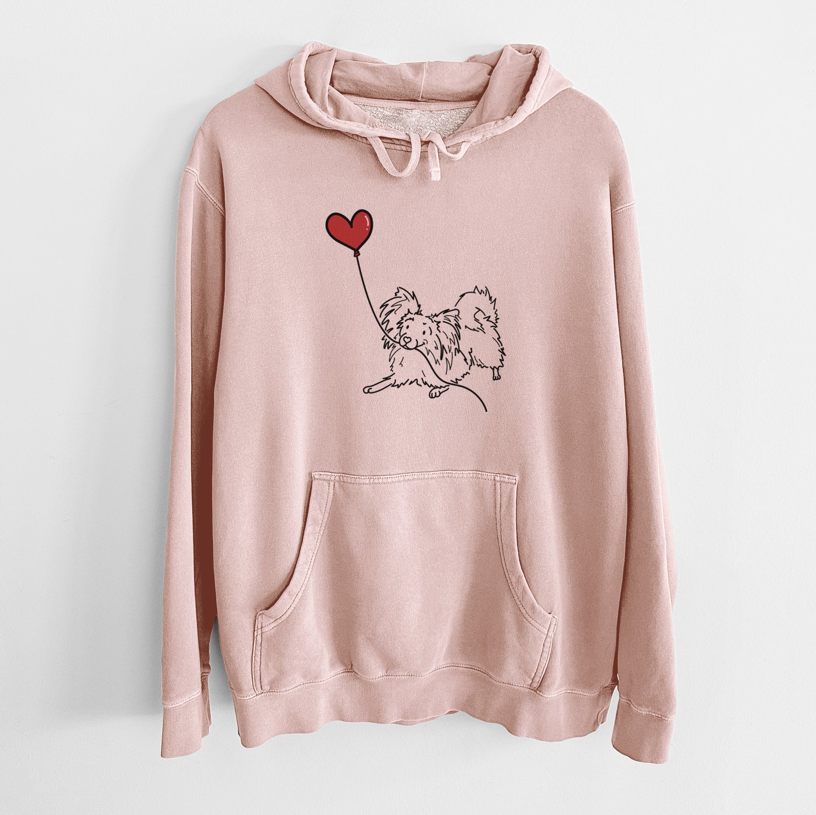 Minimalist line drawing of a Papillon Heart String holding a heart balloon on a Dusty Pink Unisex pigment dyed hoodie