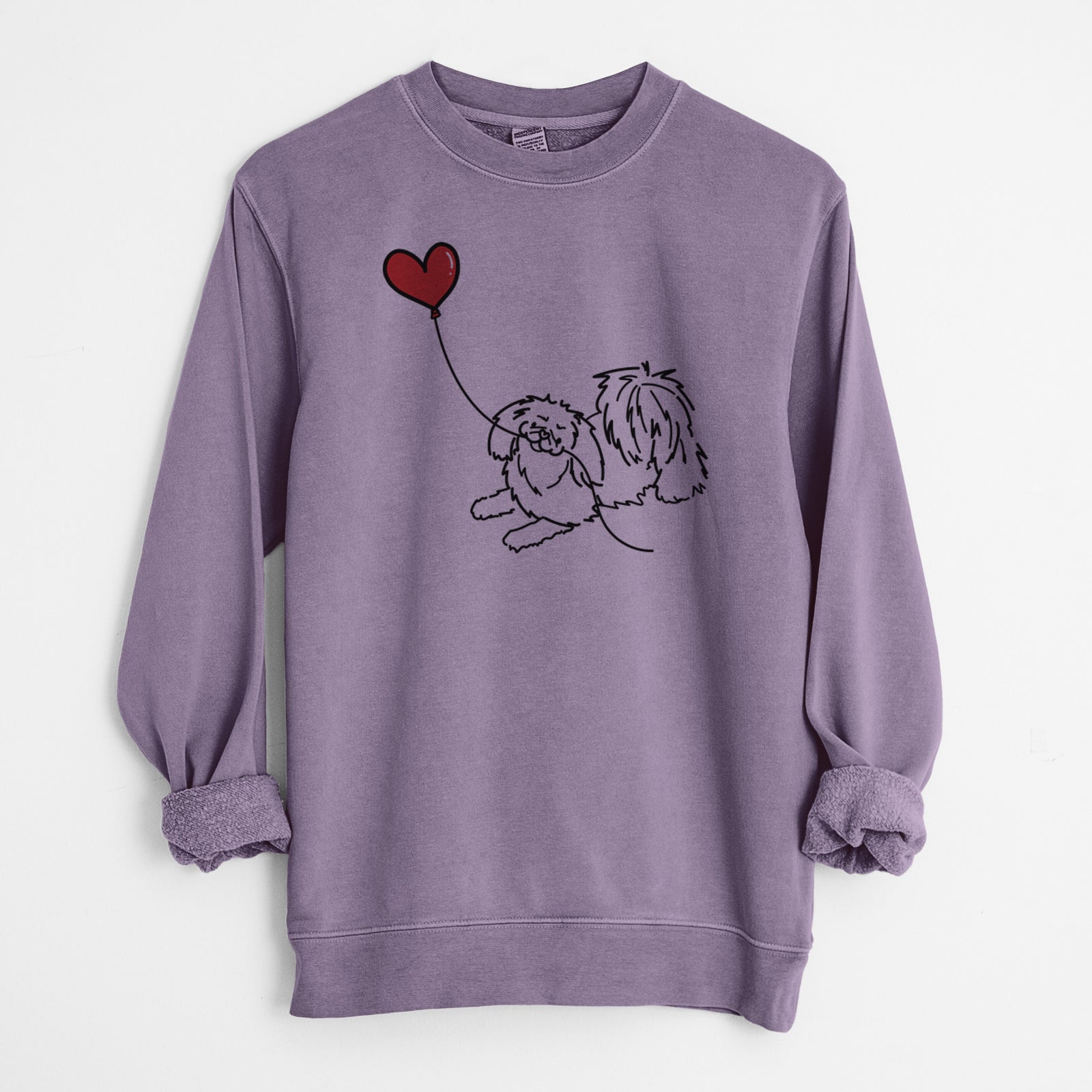 Minimalist line drawing of a Pekingese Heart String holding a heart balloon on a Plum Unisex pigment dyed crew sweatshirt