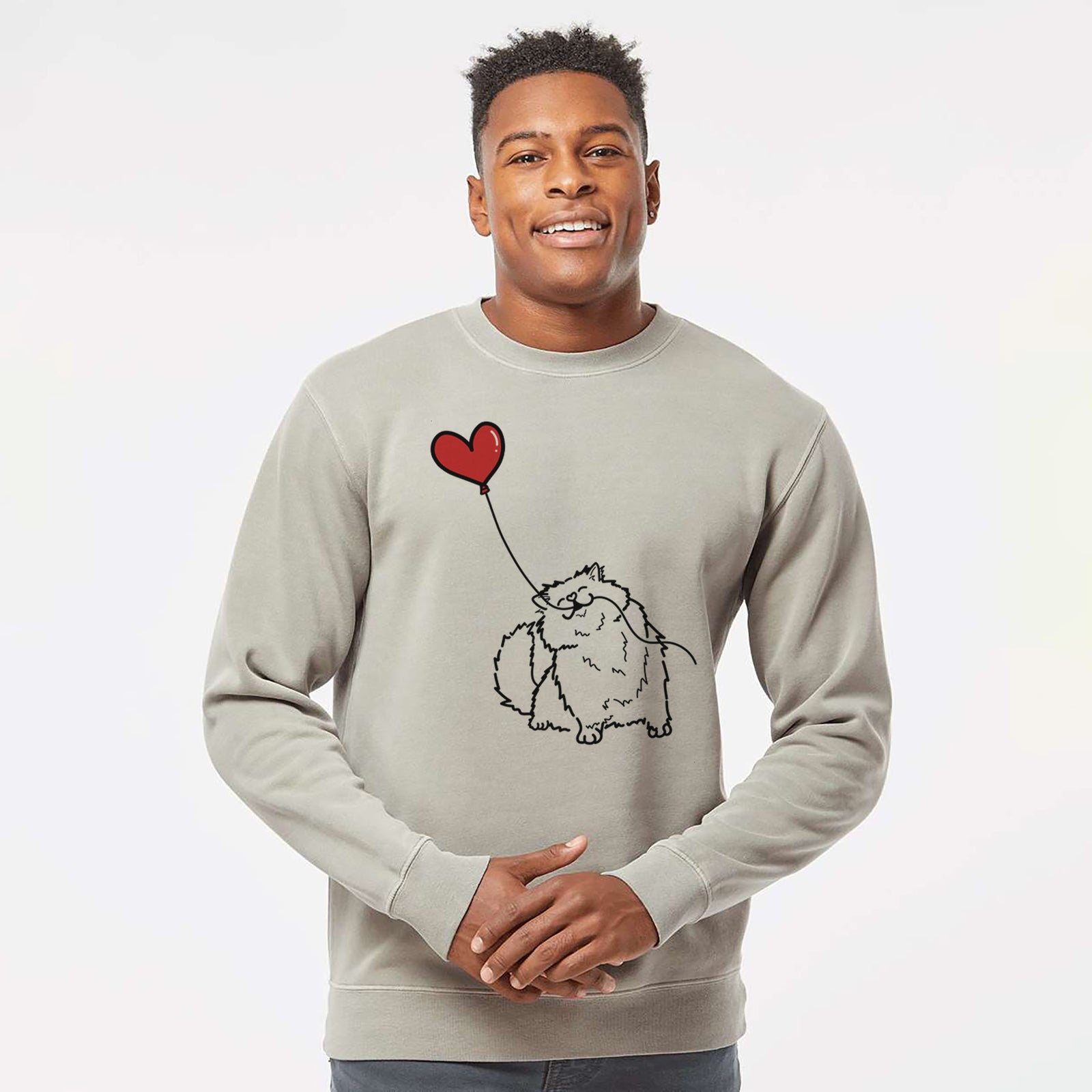 Minimalist line drawing of a Persian Cat Heart String holding a heart balloon on a Cement Unisex pigment dyed crew sweatshirt